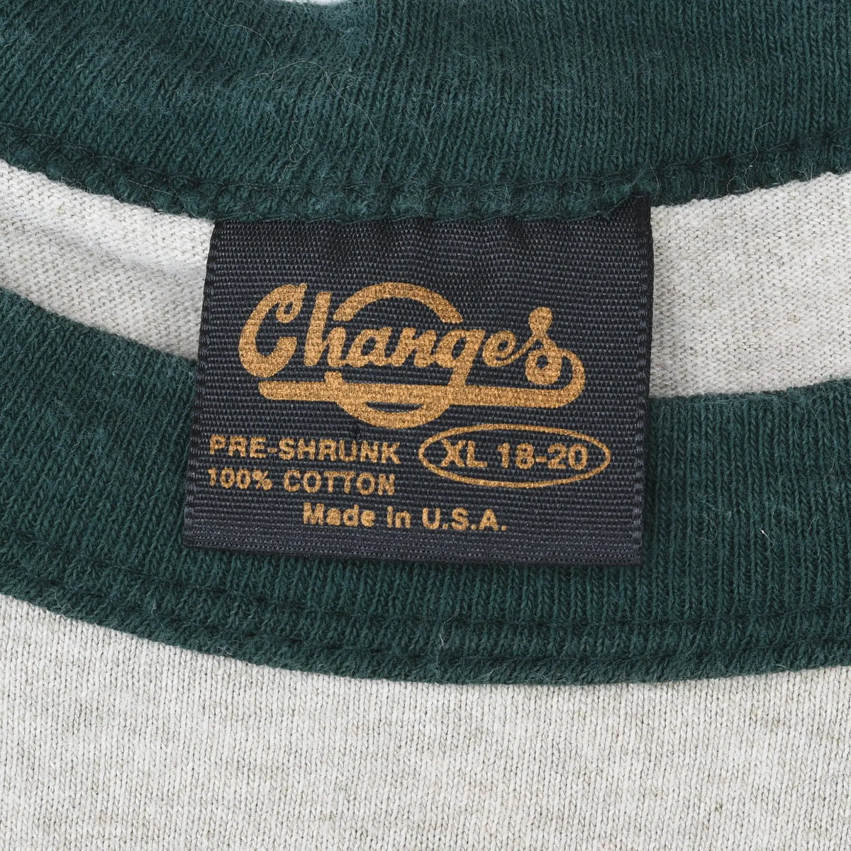 Changes neck tag marked XL 18-20, pre-shrunk 100% cotton and Made in USA