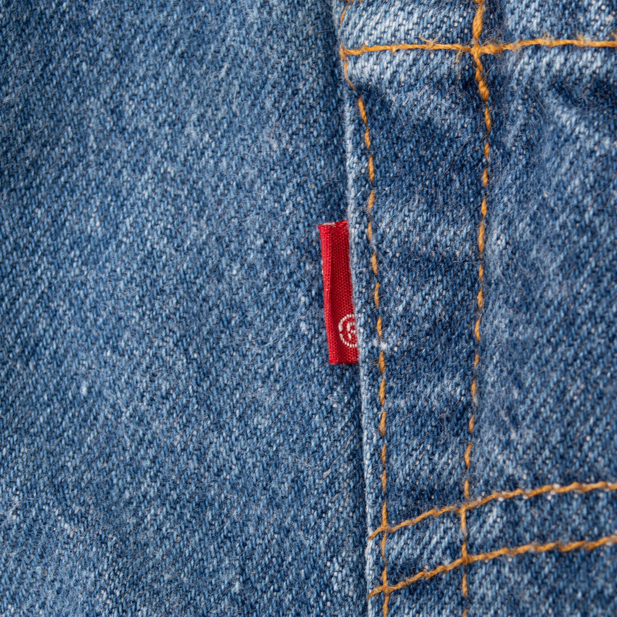 Close-up of Levi's red tab beside the back pocket seam