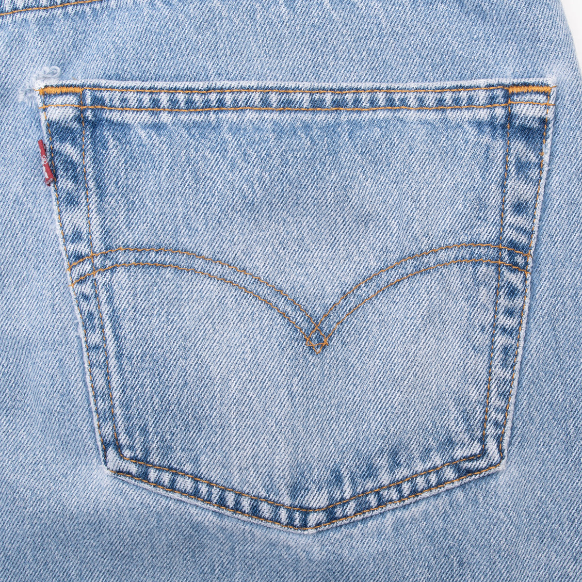 Levi's back pocket with arcuate stitching on light wash blue denim