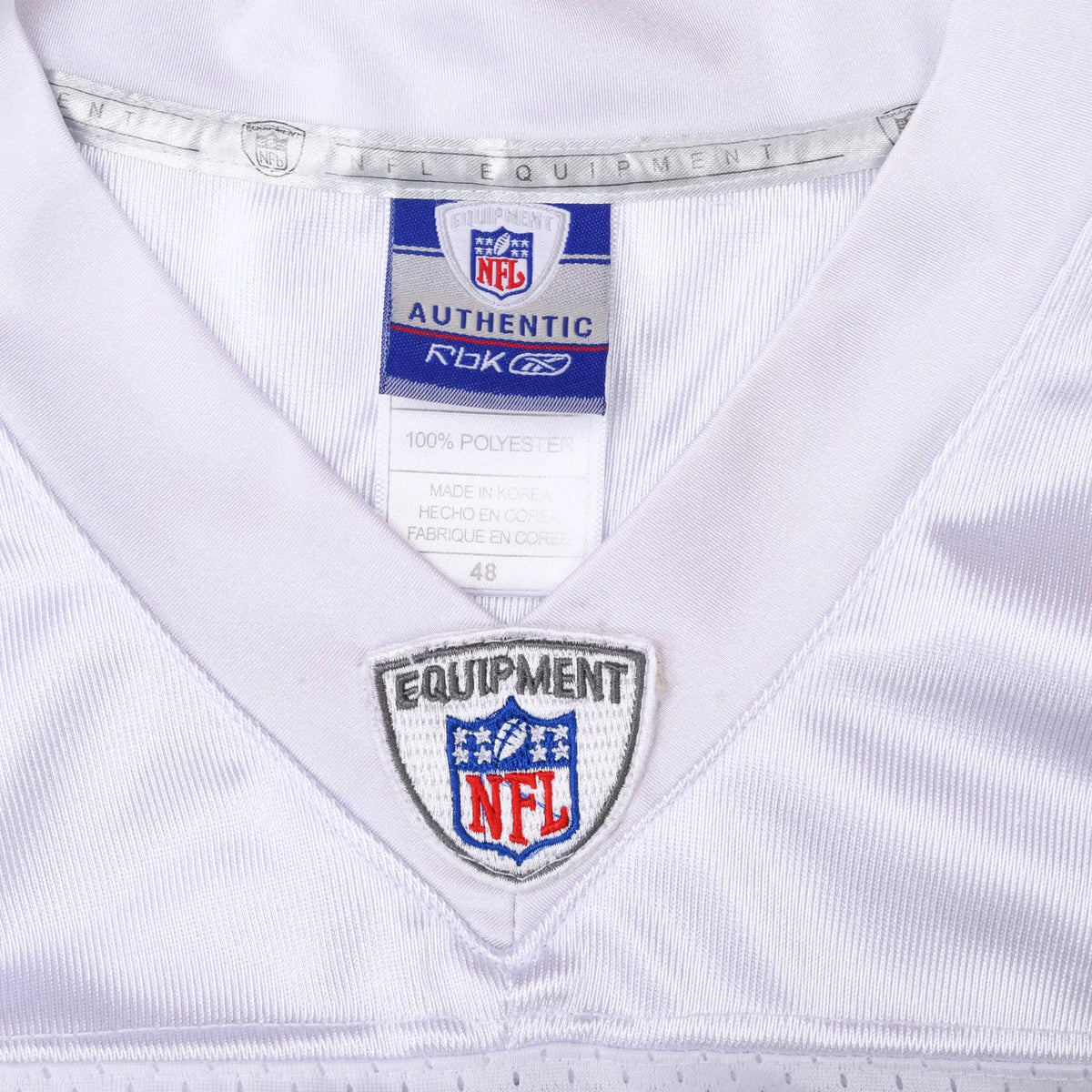 Reebok NFL neck label and Equipment NFL shield on white jersey collar