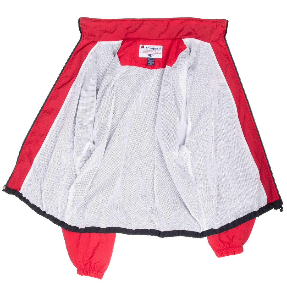 Open Champion windbreaker interior with white mesh lining and red trim
