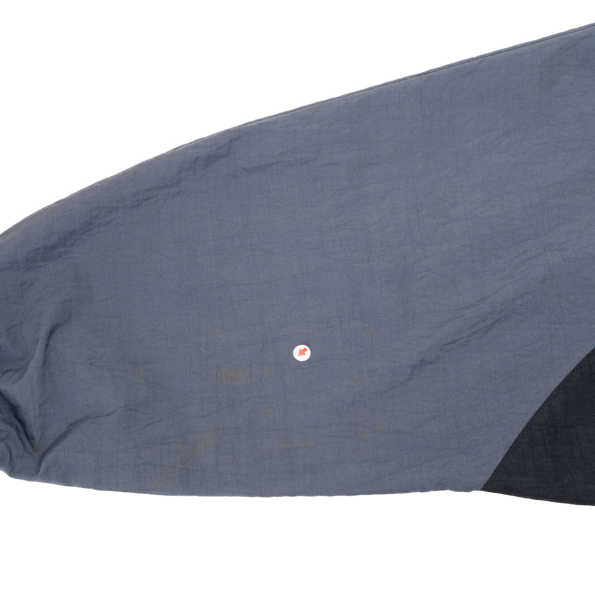 Close-up of faint discoloration on gray jacket sleeve