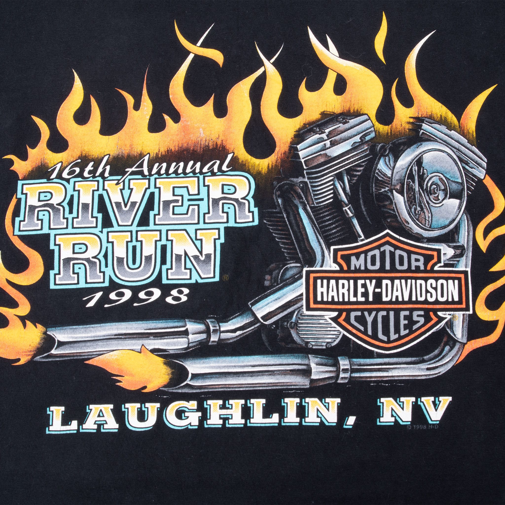 Close-up of River Run 1998 back graphic with flames, engine and Harley-Davidson shield