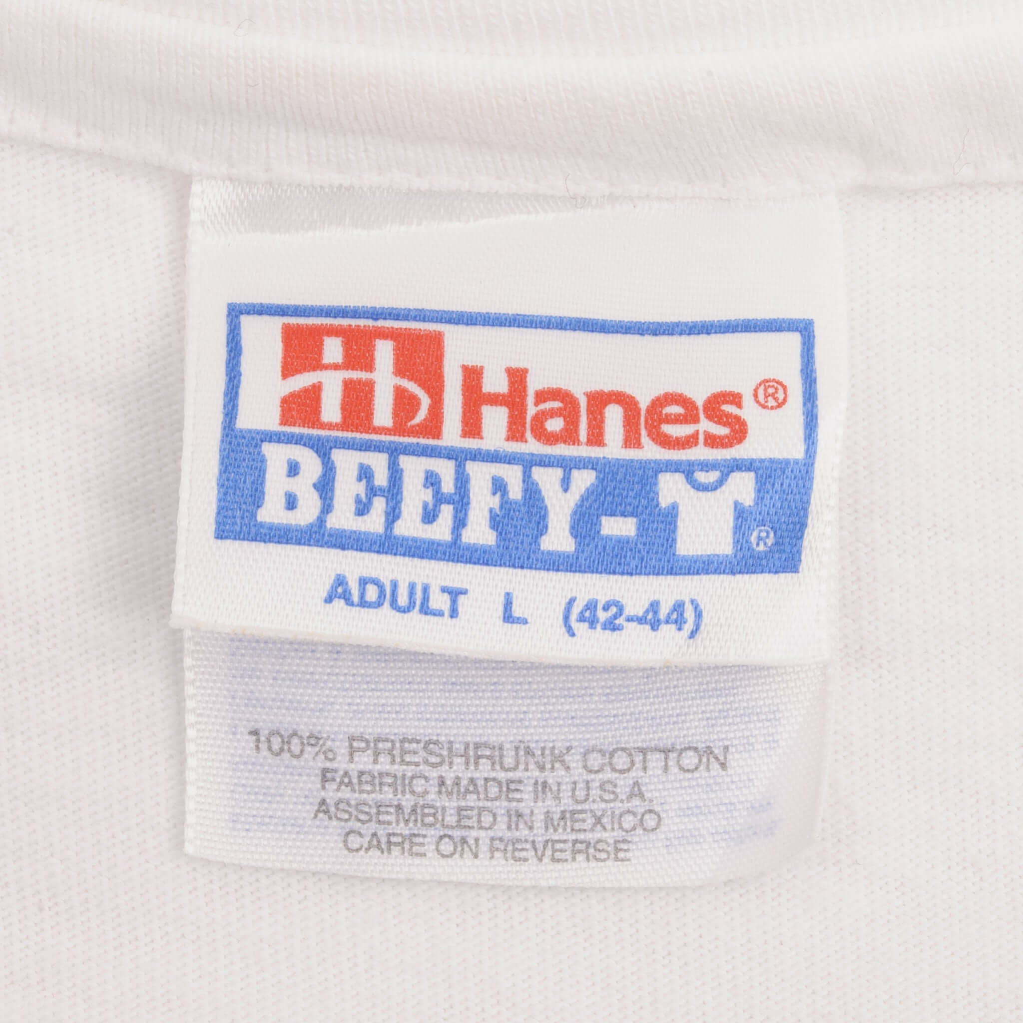 Hanes Beefy-T neck label marked Adult L 42–44 on white T-shirt