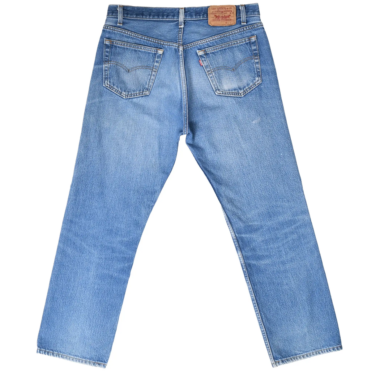 Back view of Levi's 501 blue jeans with two stitched pockets, red tab, and waistband patch