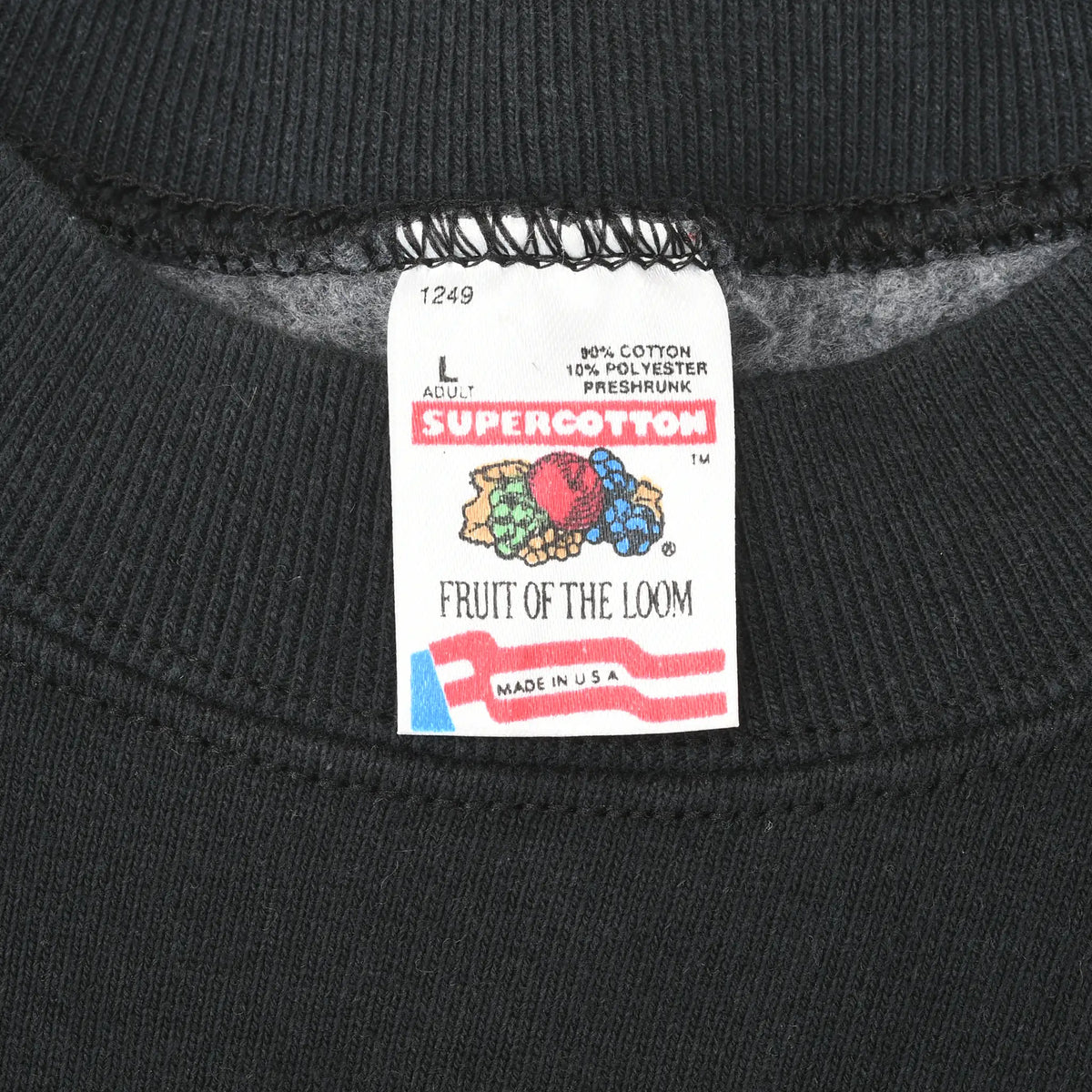 Fruit of the Loom size L neck label showing 90% cotton, 10% polyester and Made in USA