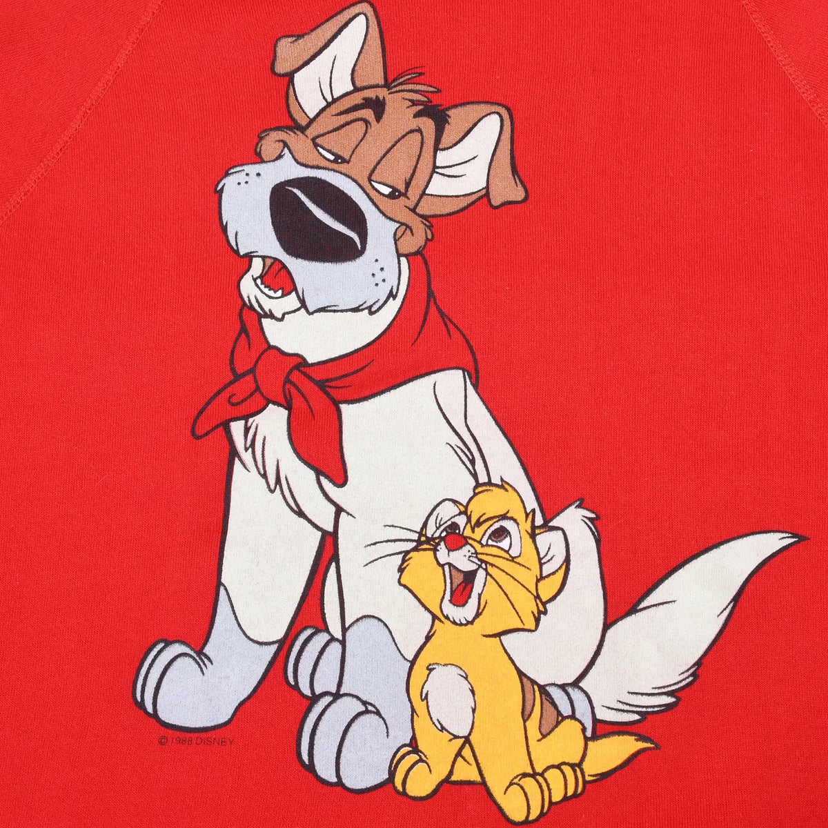 Close-up of Oliver and Dodger graphic printed on red sweatshirt