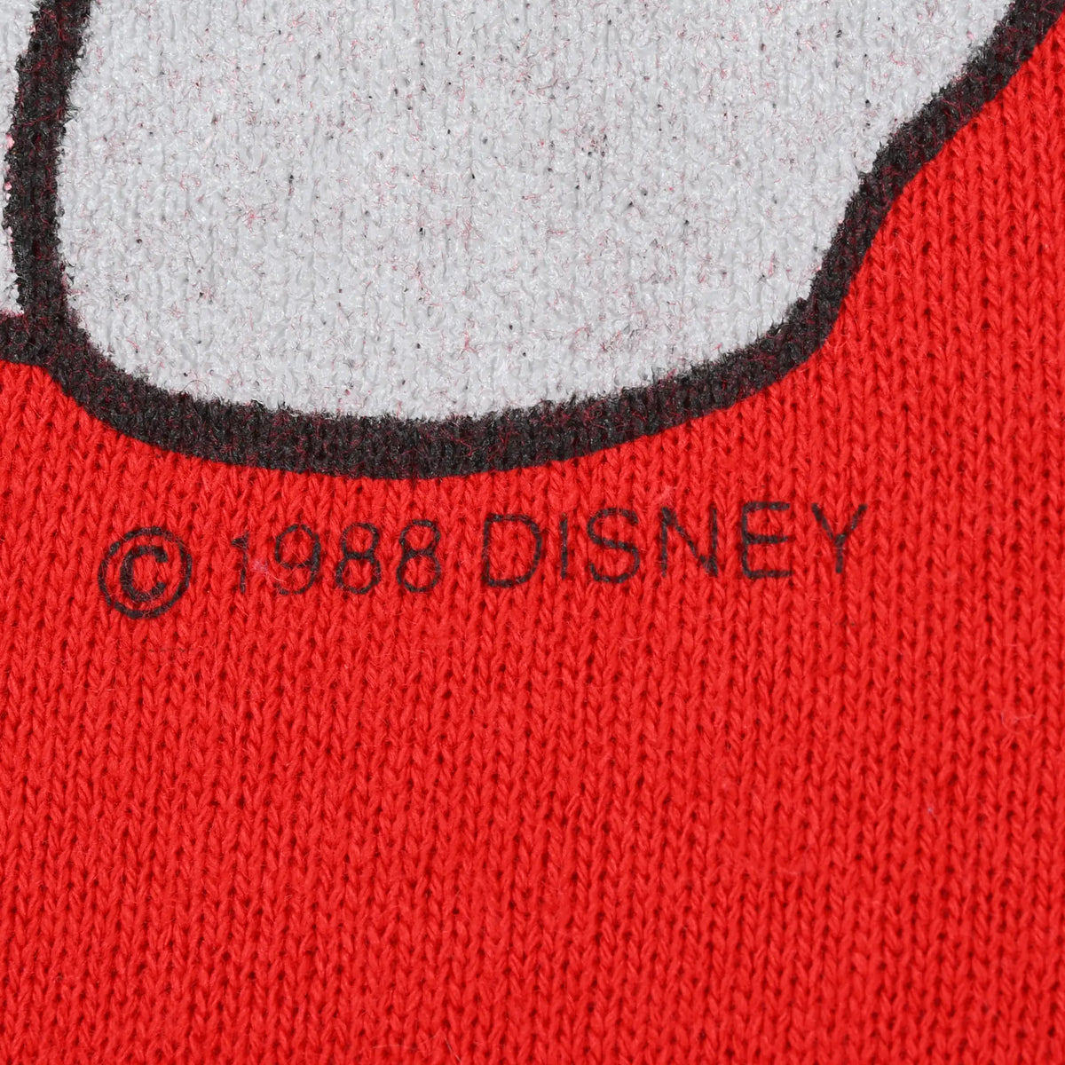 Close-up of © 1988 Disney copyright mark beneath sweatshirt graphic