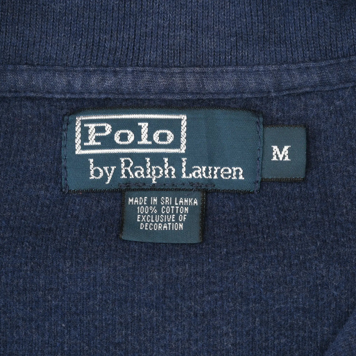 Polo by Ralph Lauren neck label and medium size tag inside blue sweater
