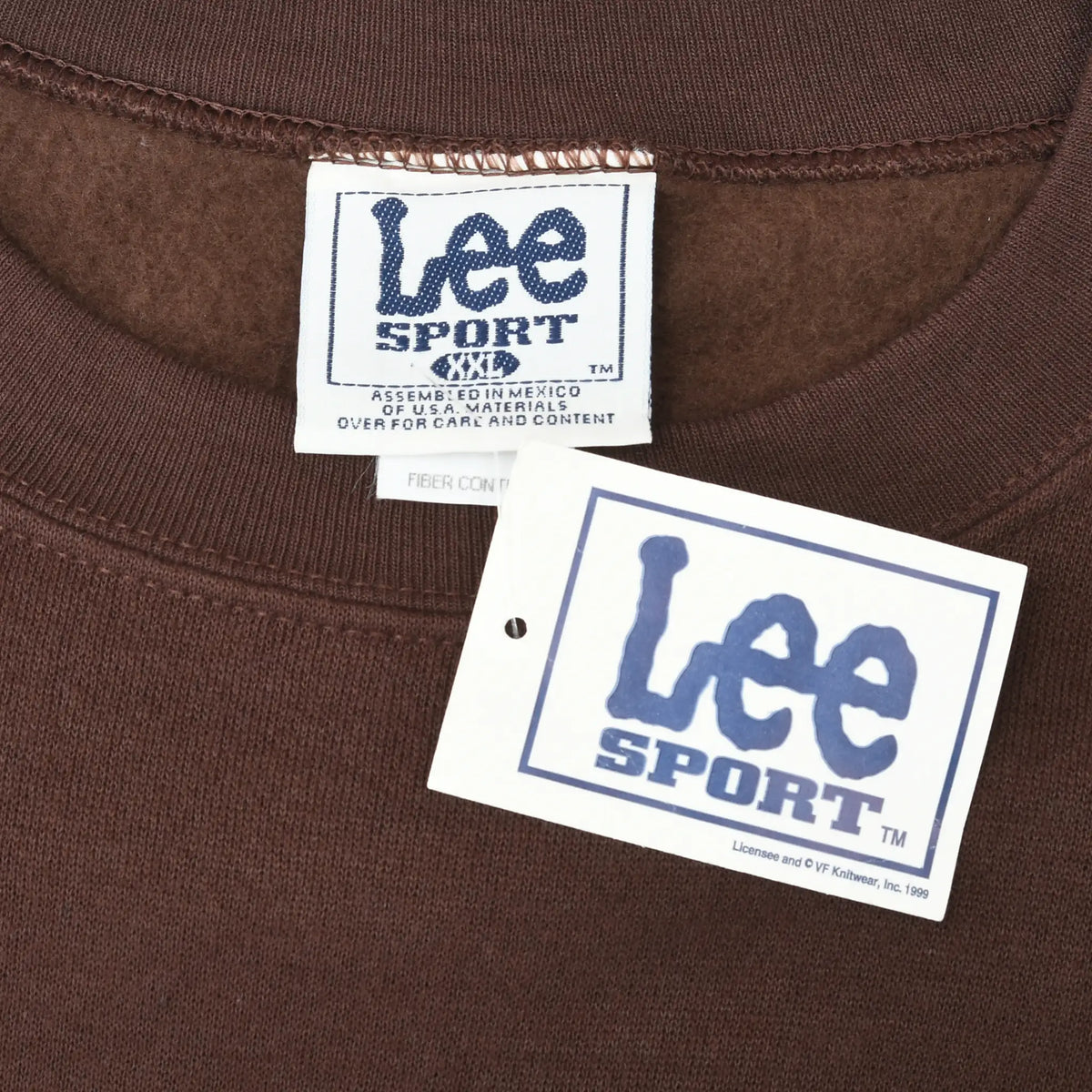 Close-up of Lee Sport neck label and attached hangtag on brown sweatshirt