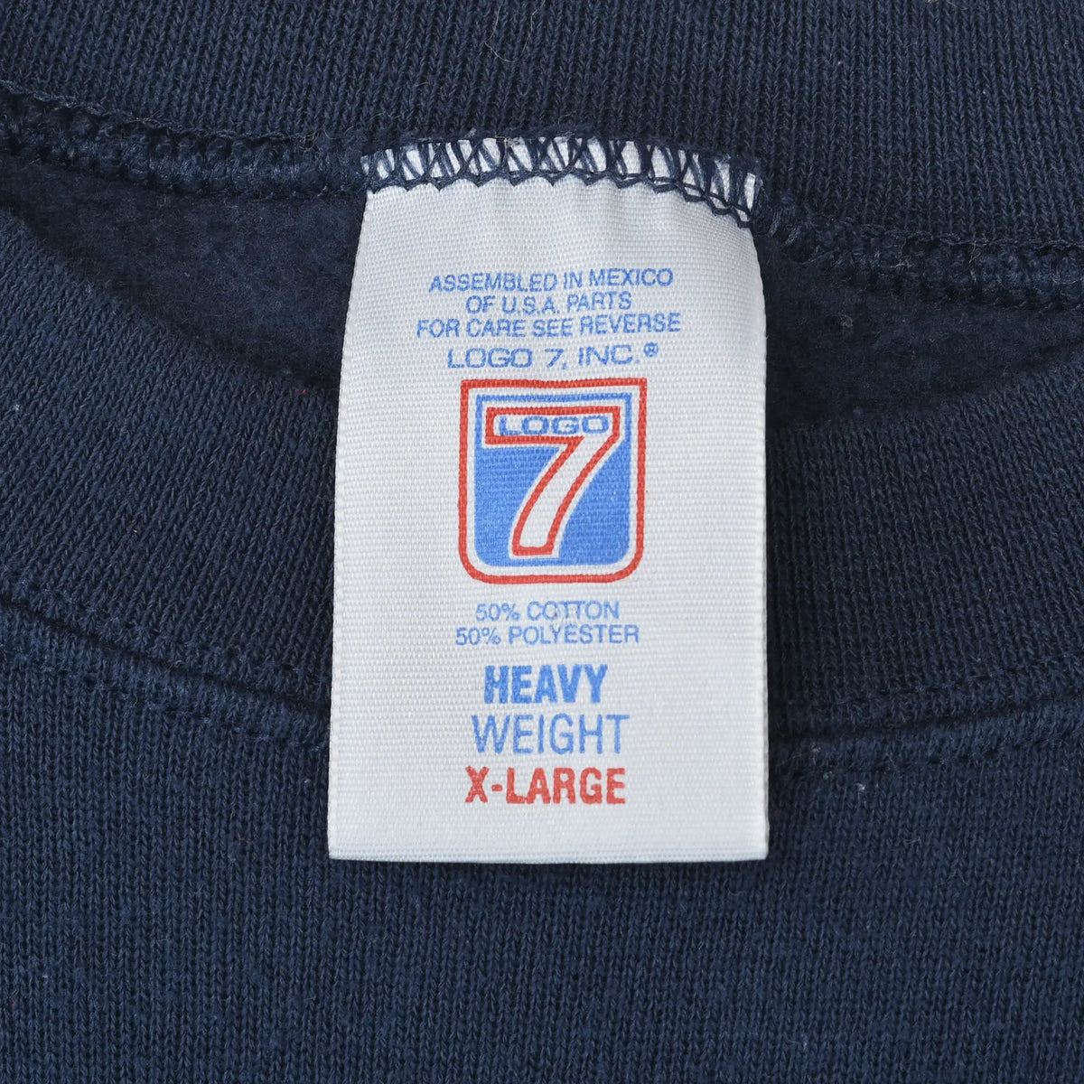 Logo 7 X-Large Heavy Weight neck tag showing 50% cotton and 50% polyester