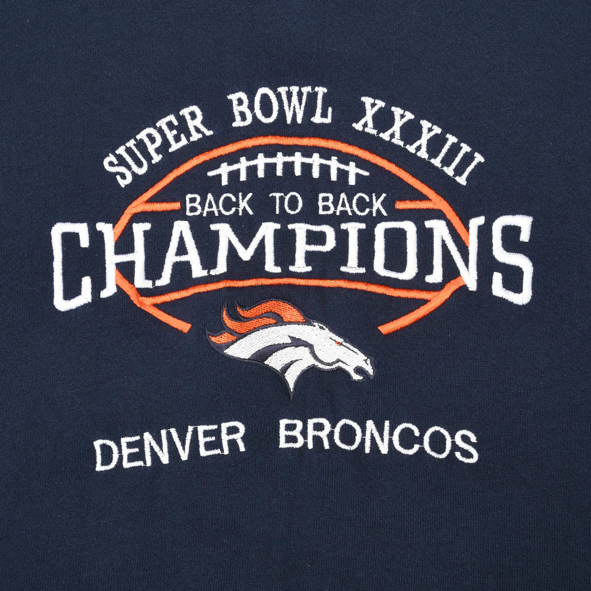 Close-up of Denver Broncos Super Bowl XXXIII back-to-back champions chest graphic