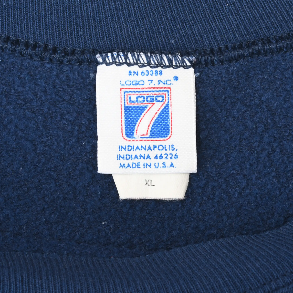 Logo 7 neck tag marked XL and Made in U.S.A. inside navy sweatshirt