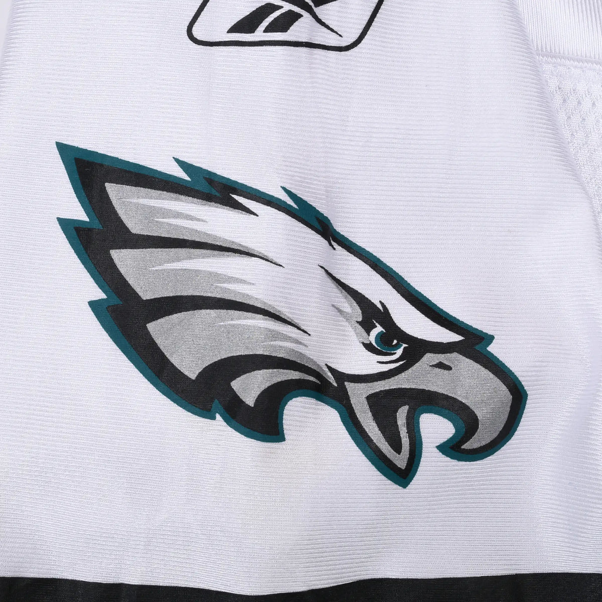 Close-up of Philadelphia Eagles logo print on white jersey sleeve