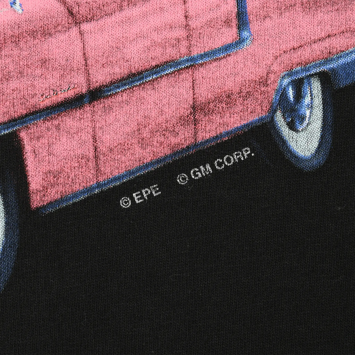 Close-up of pink Cadillac print showing EPE and GM copyright marks