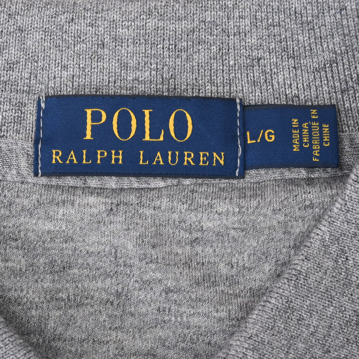 Polo Ralph Lauren neck label marked L/G on grey fabric