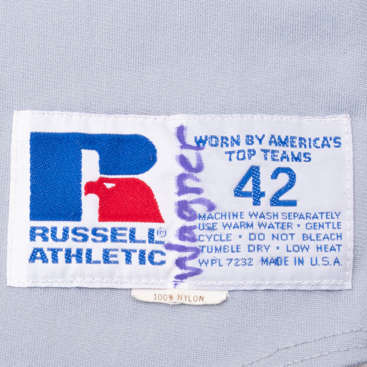 Russell Athletic jersey label showing size 42 and care instructions