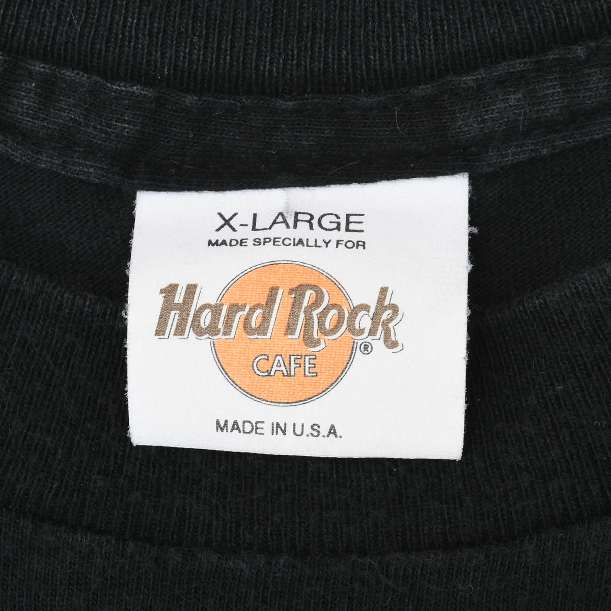 Hard Rock Cafe neck label marked X-Large and Made in U.S.A. inside black T-shirt