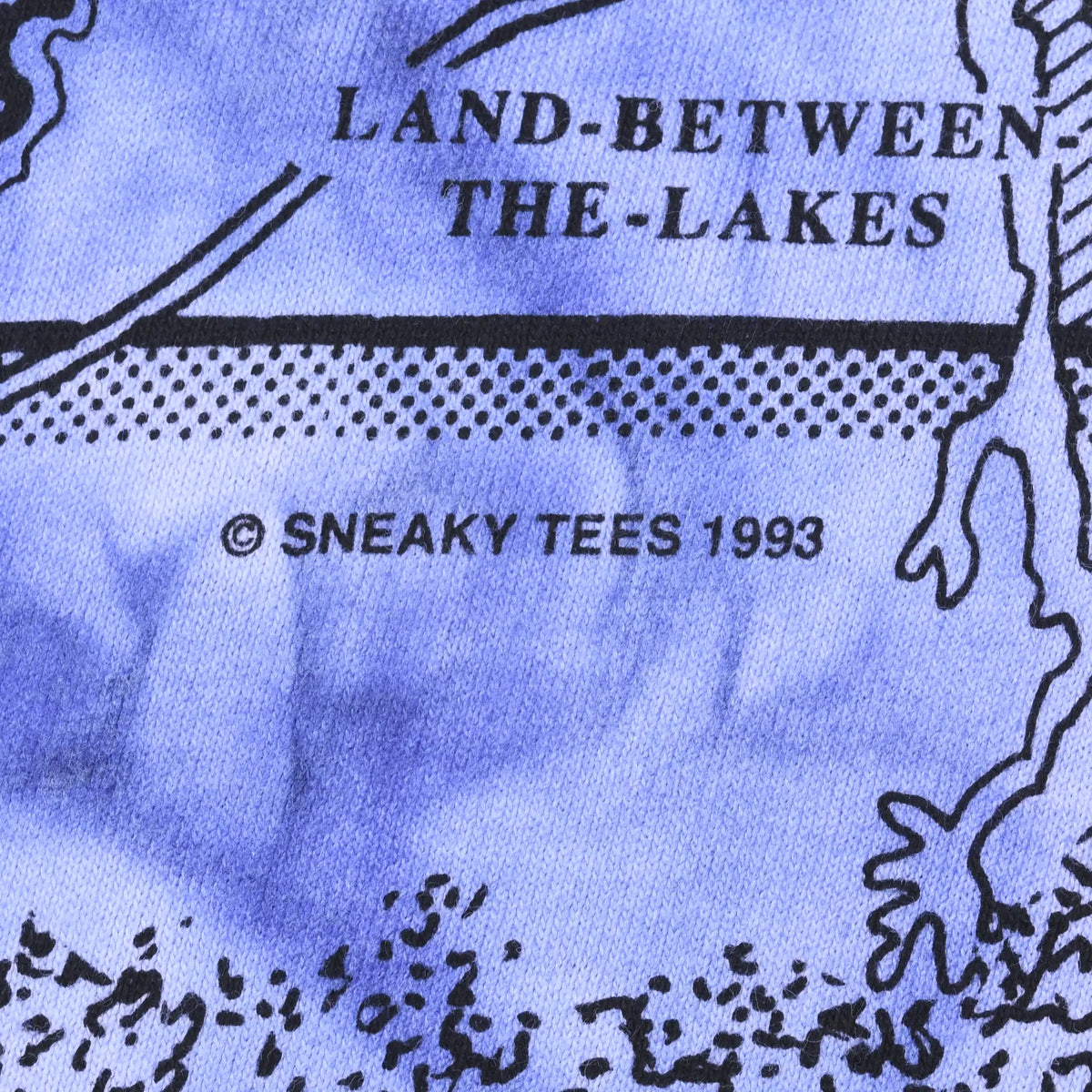 Close-up of Land Between the Lakes graphic and Sneaky Tees 1993 copyright print