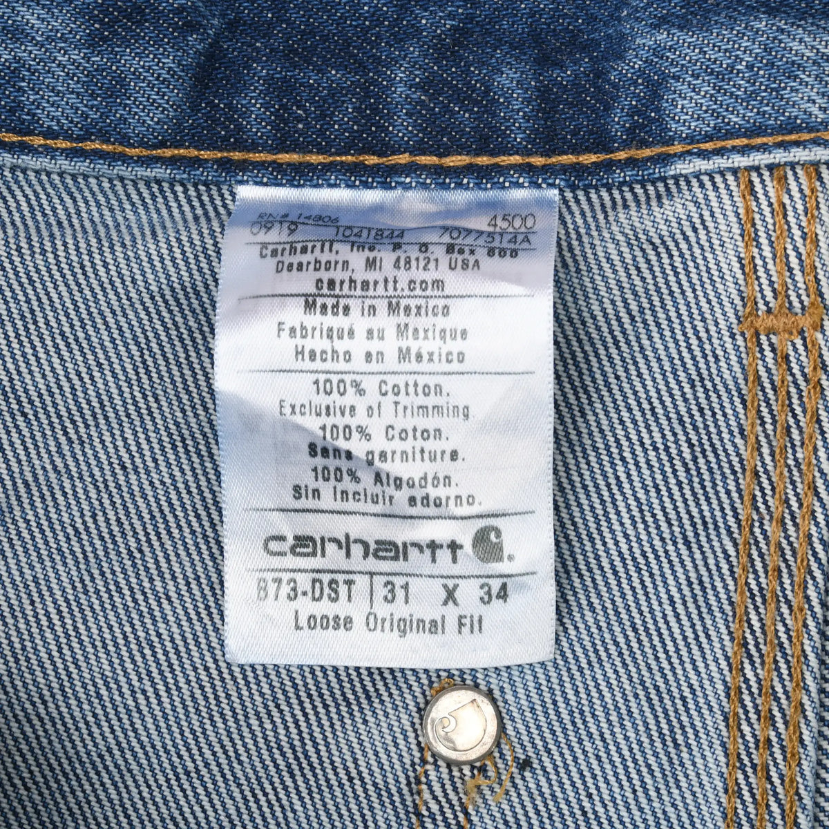 Interior Carhartt label showing B73-DST, 31 x 34, loose original fit, and 100% cotton