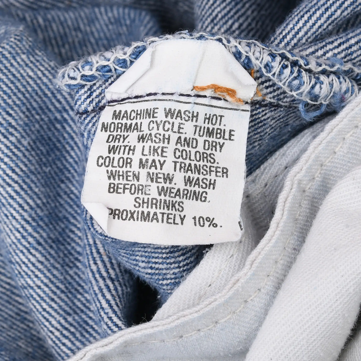 Close-up of interior Levi's care label with machine-wash and shrinkage instructions
