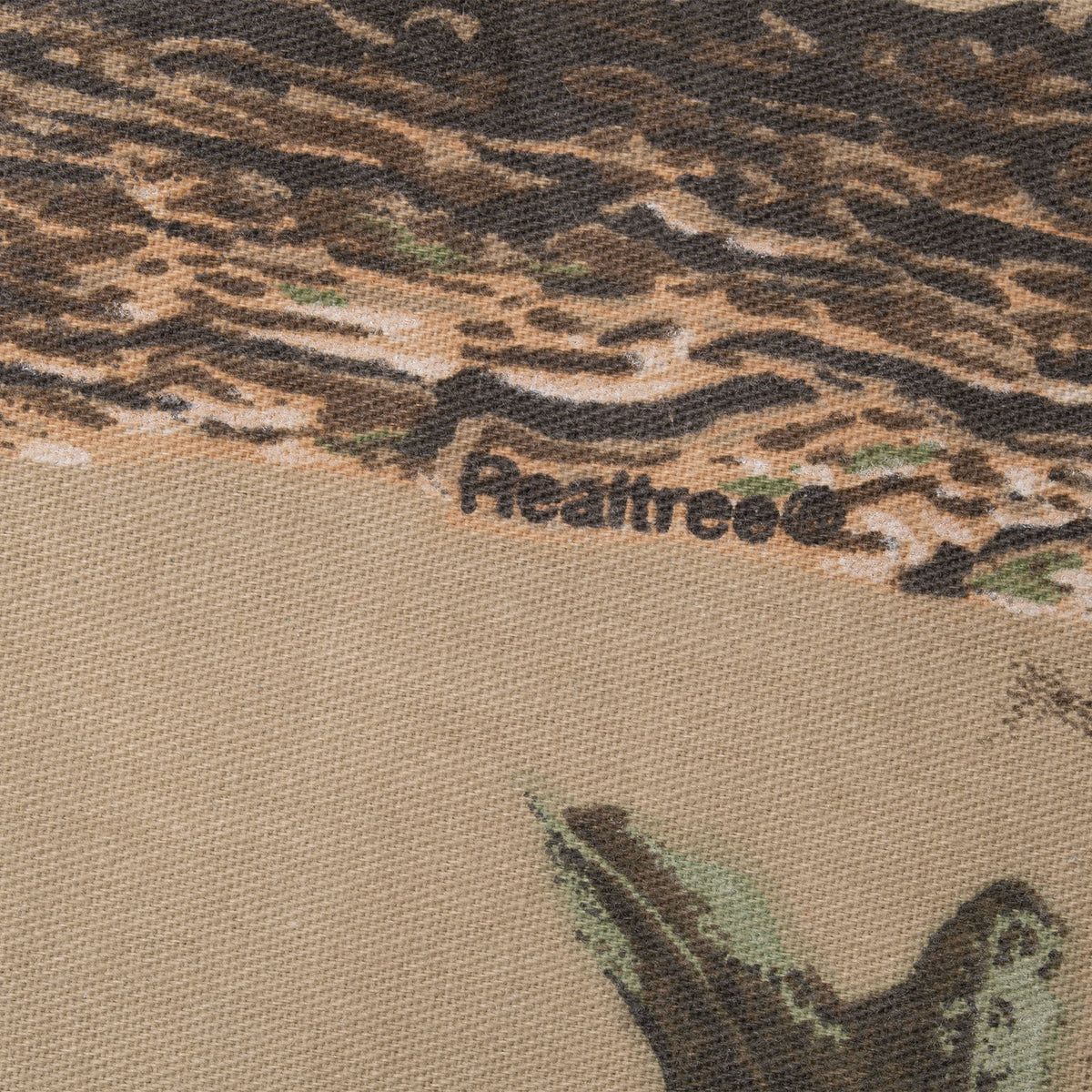 Close-up of Realtree logo printed on camouflage fabric