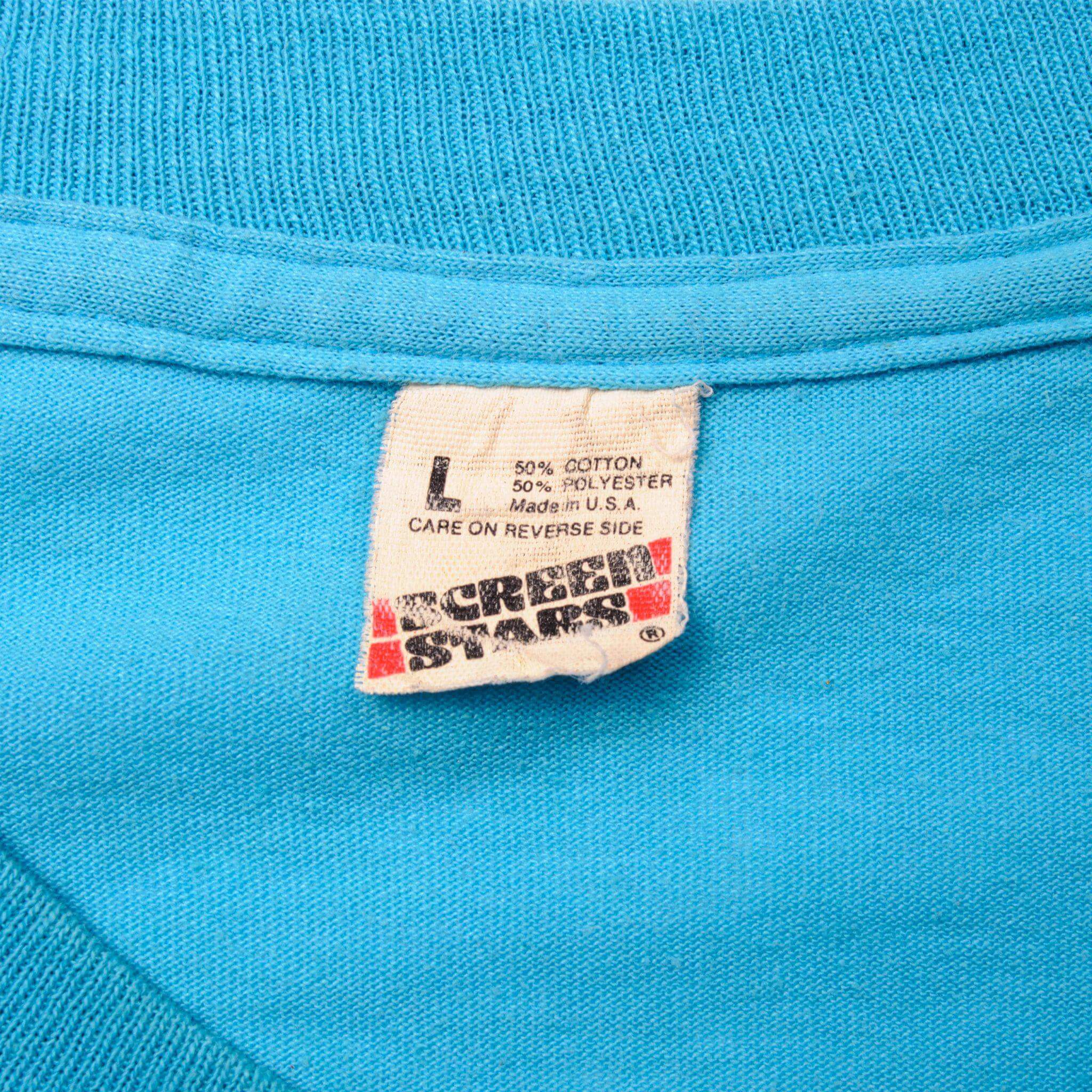 Vintage Sex Pistols God Save The Queen She Aint No Human Being Screen Stars Tee Shirt 1980s Size Medium Made In USA with single stitch sleeves.