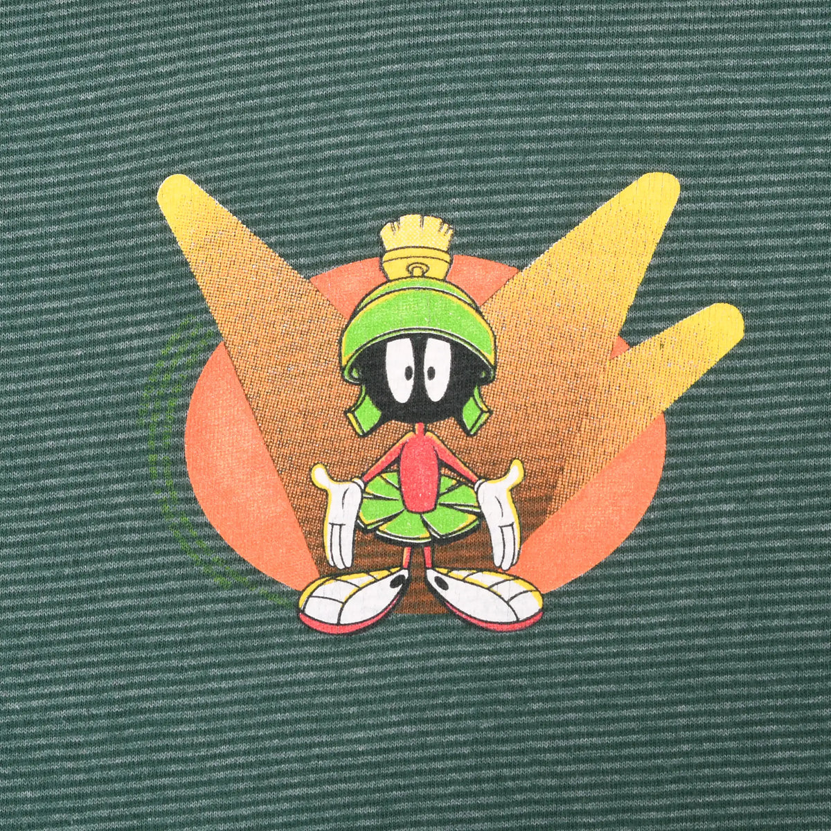 Close-up of Marvin the Martian chest print on green striped fabric
