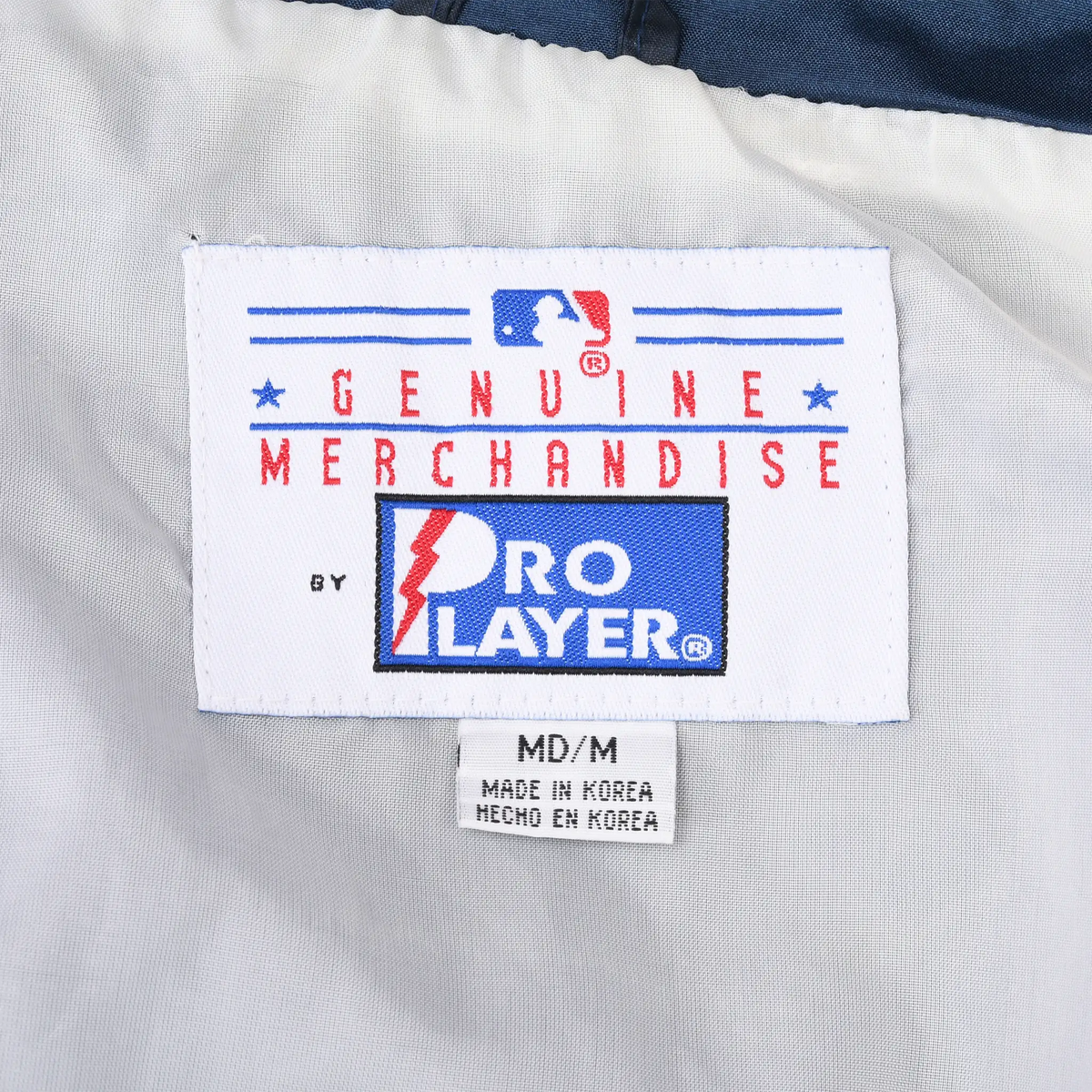 Close-up of MLB Genuine Merchandise and Pro Player neck labels inside the Yankees jacket