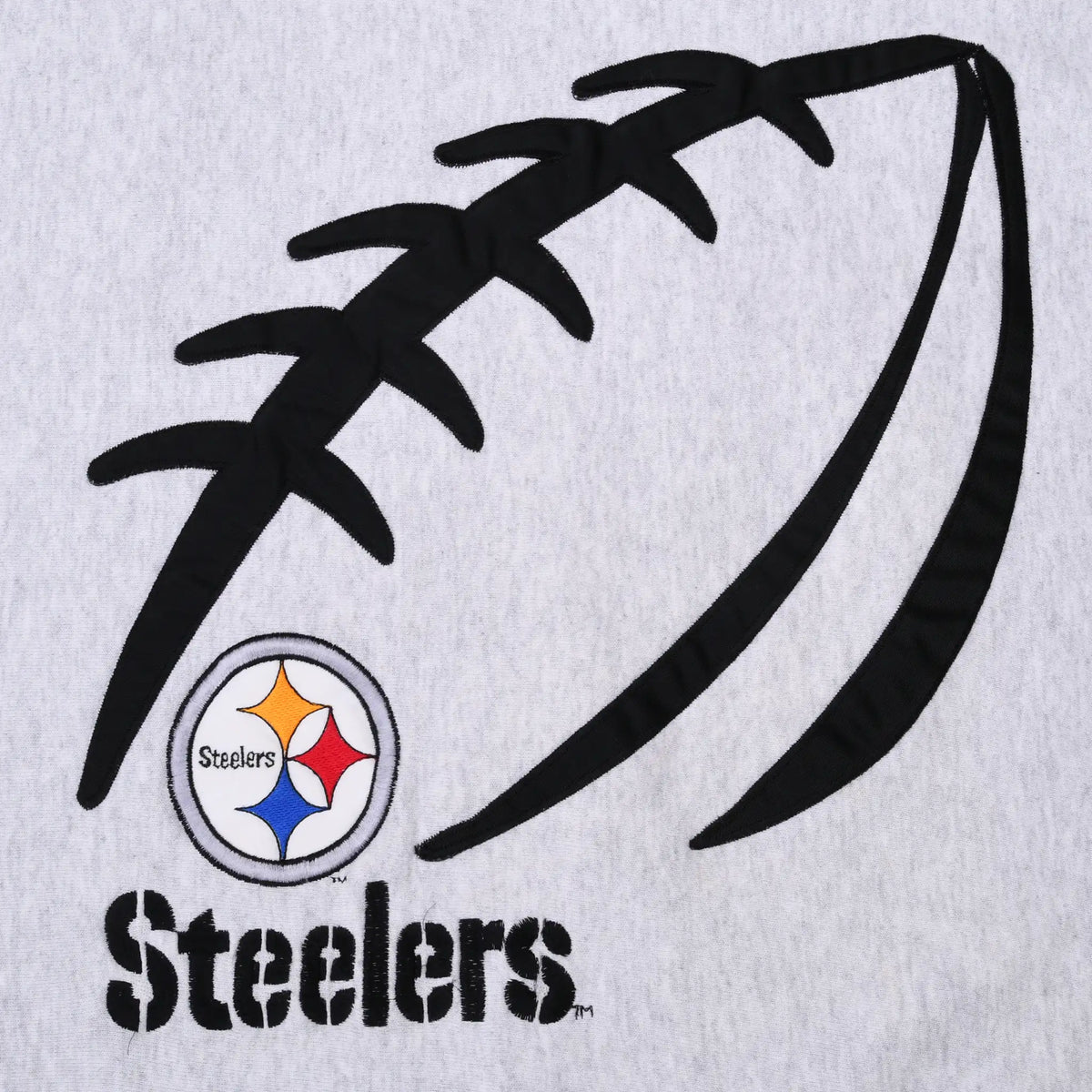 Close-up of black football graphic, Pittsburgh Steelers logo and team name