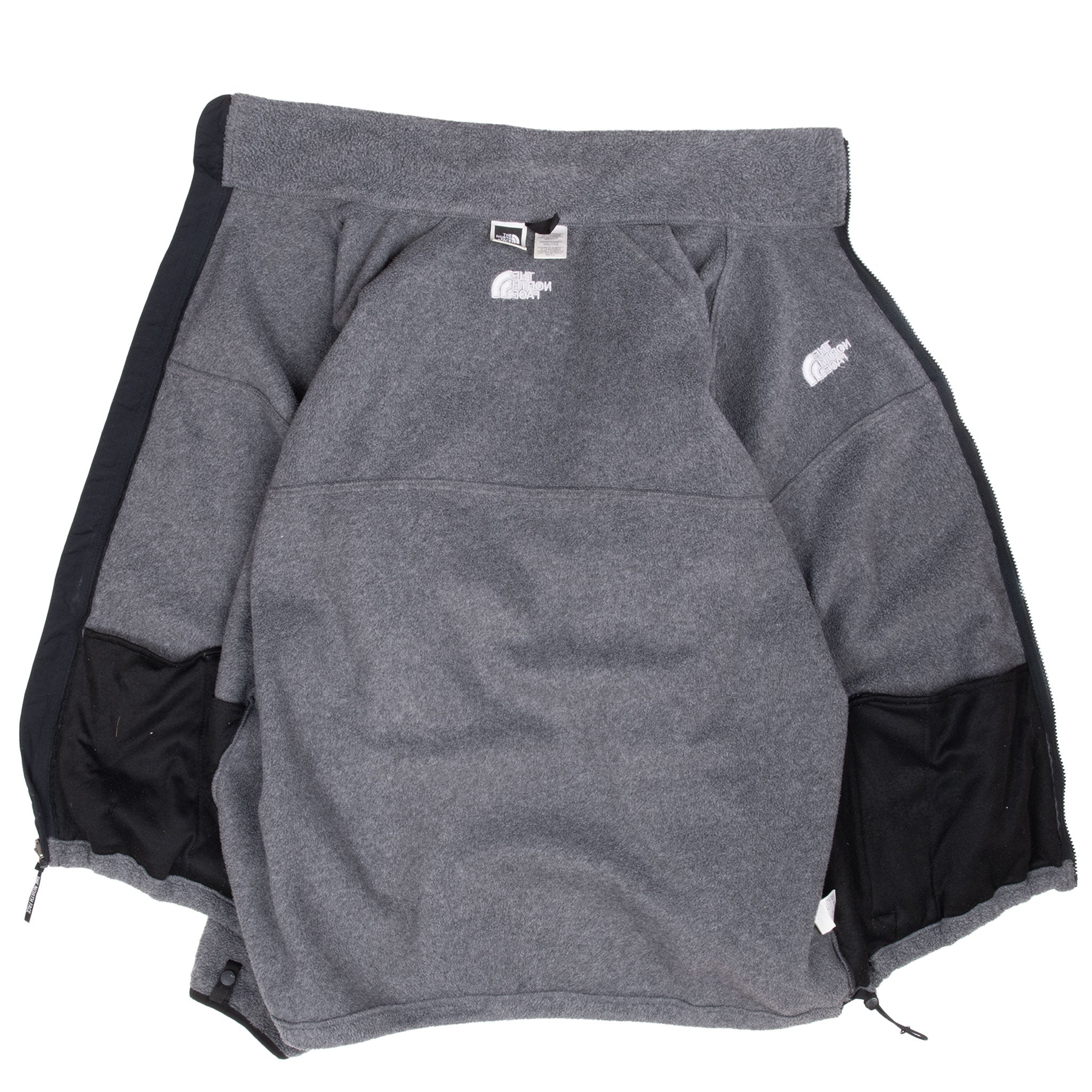 Open grey The North Face fleece jacket showing the interior and black collar lining