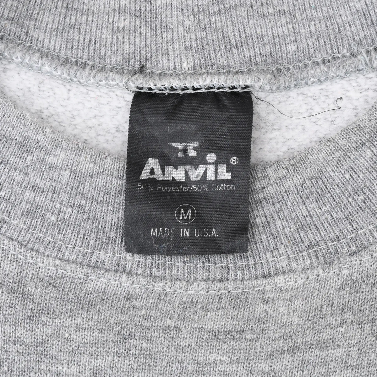 Anvil neck tag marked medium and Made in USA inside gray sweatshirt