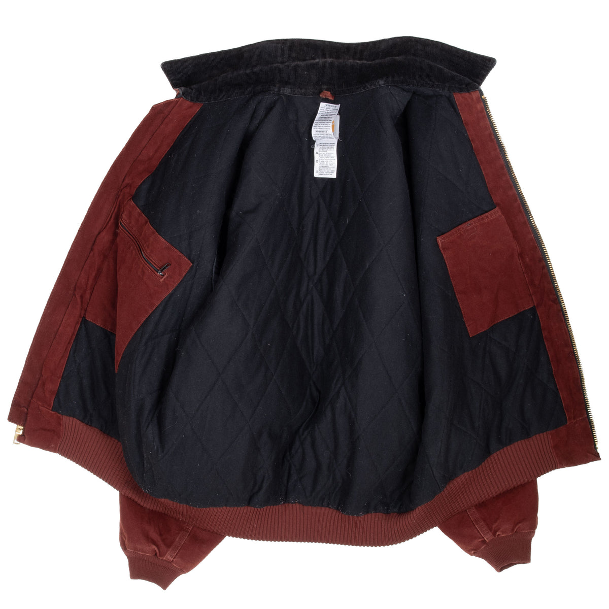 Open Carhartt Santa Fe jacket showing black quilted lining and interior pockets