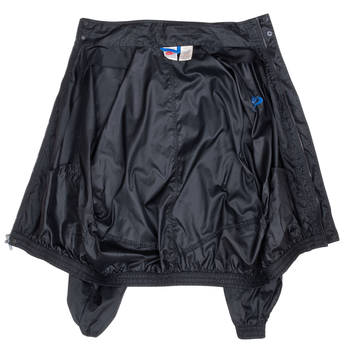 Interior view of black Nike windbreaker with front placket opened