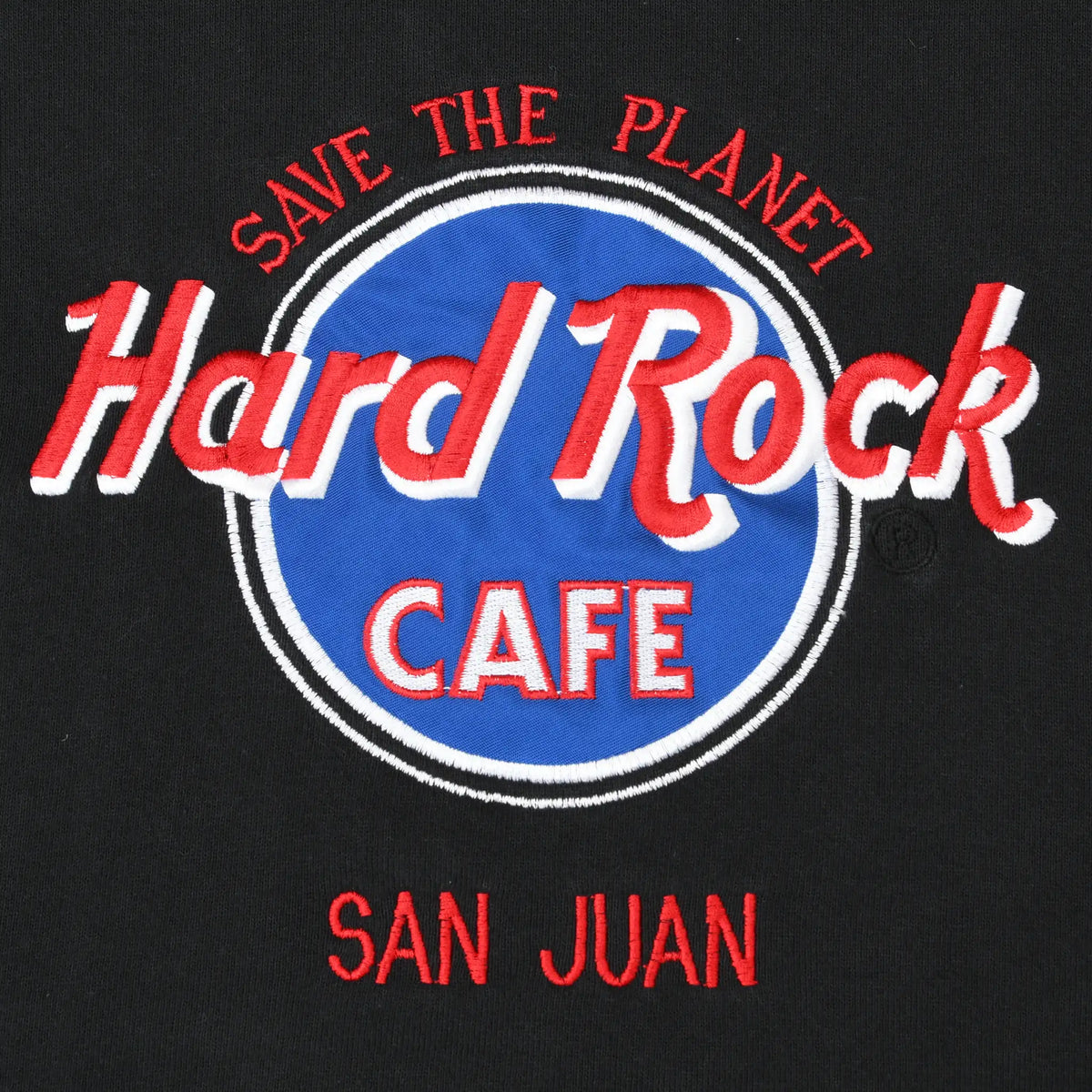 Close-up of red, white and blue Save the Planet Hard Rock Cafe San Juan chest graphic