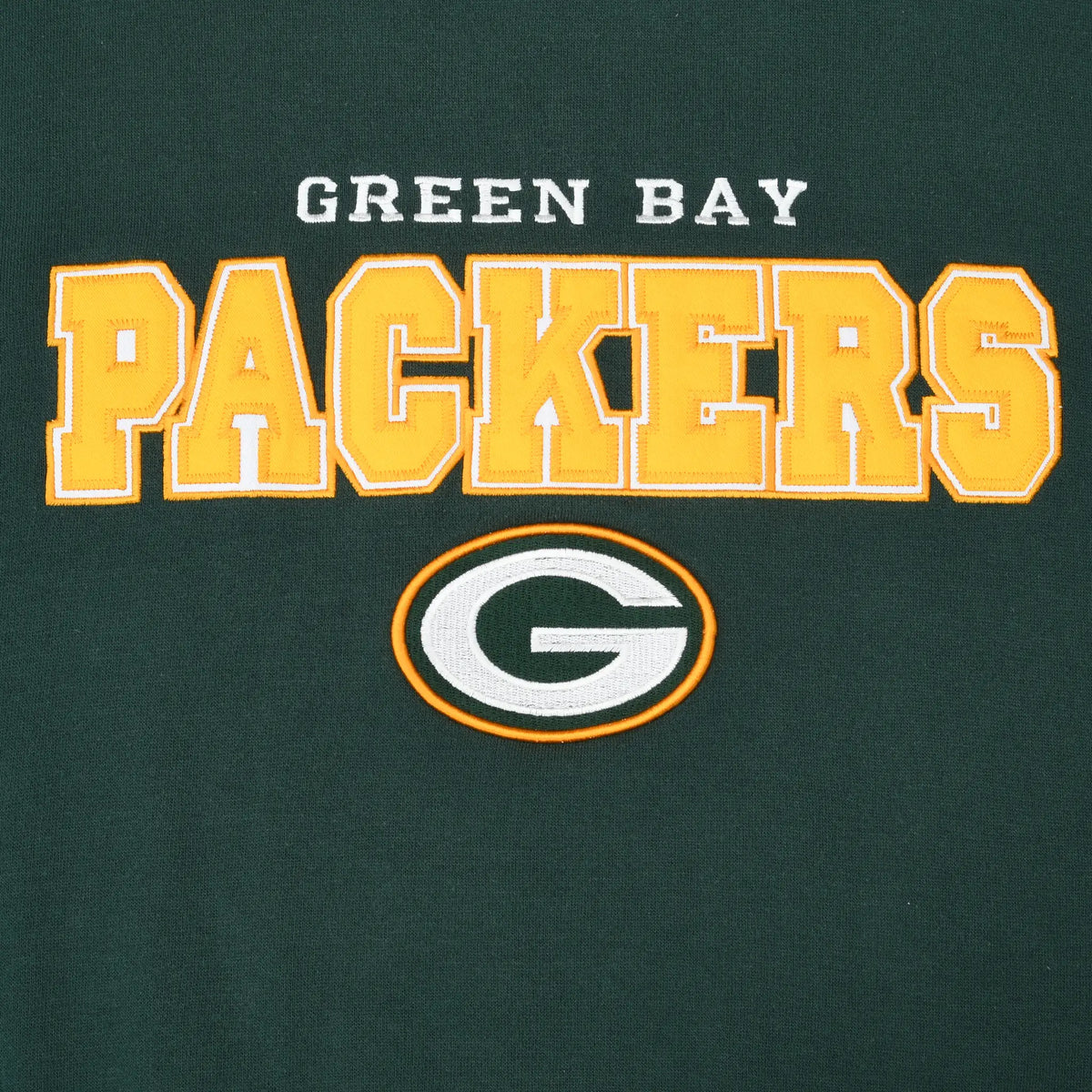 Close-up of embroidered Green Bay Packers lettering and G logo on green sweatshirt