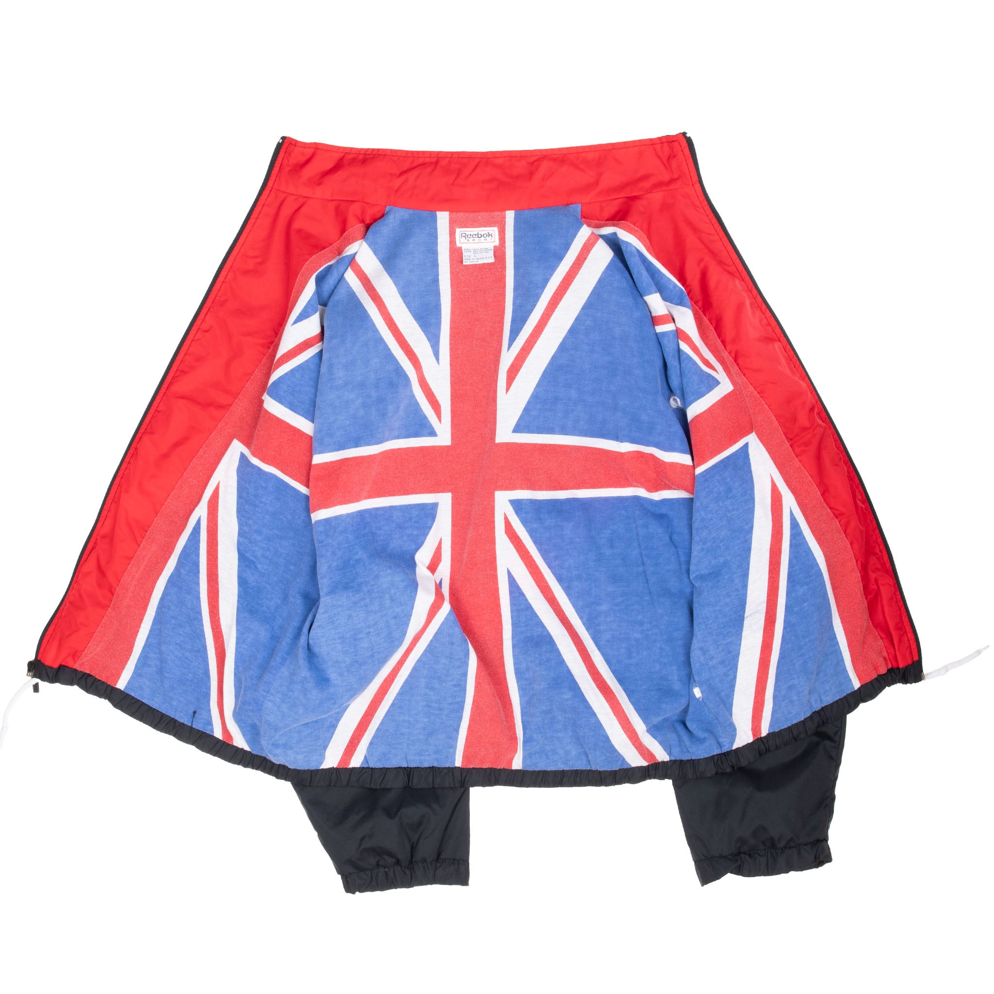 Open Reebok windbreaker showing red interior and large Union Jack lining graphic