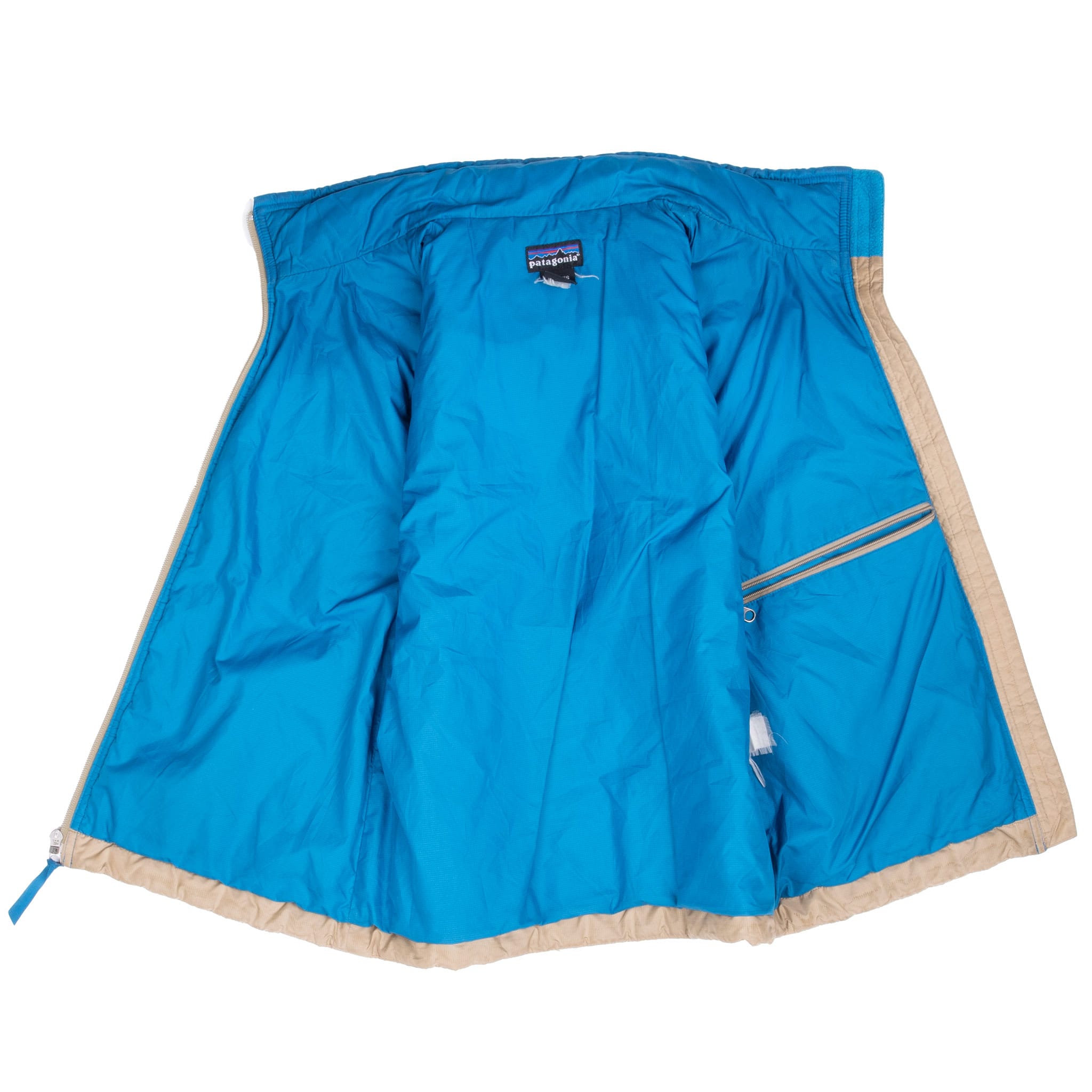 Open Patagonia vest showing bright blue lining and interior zippered pocket