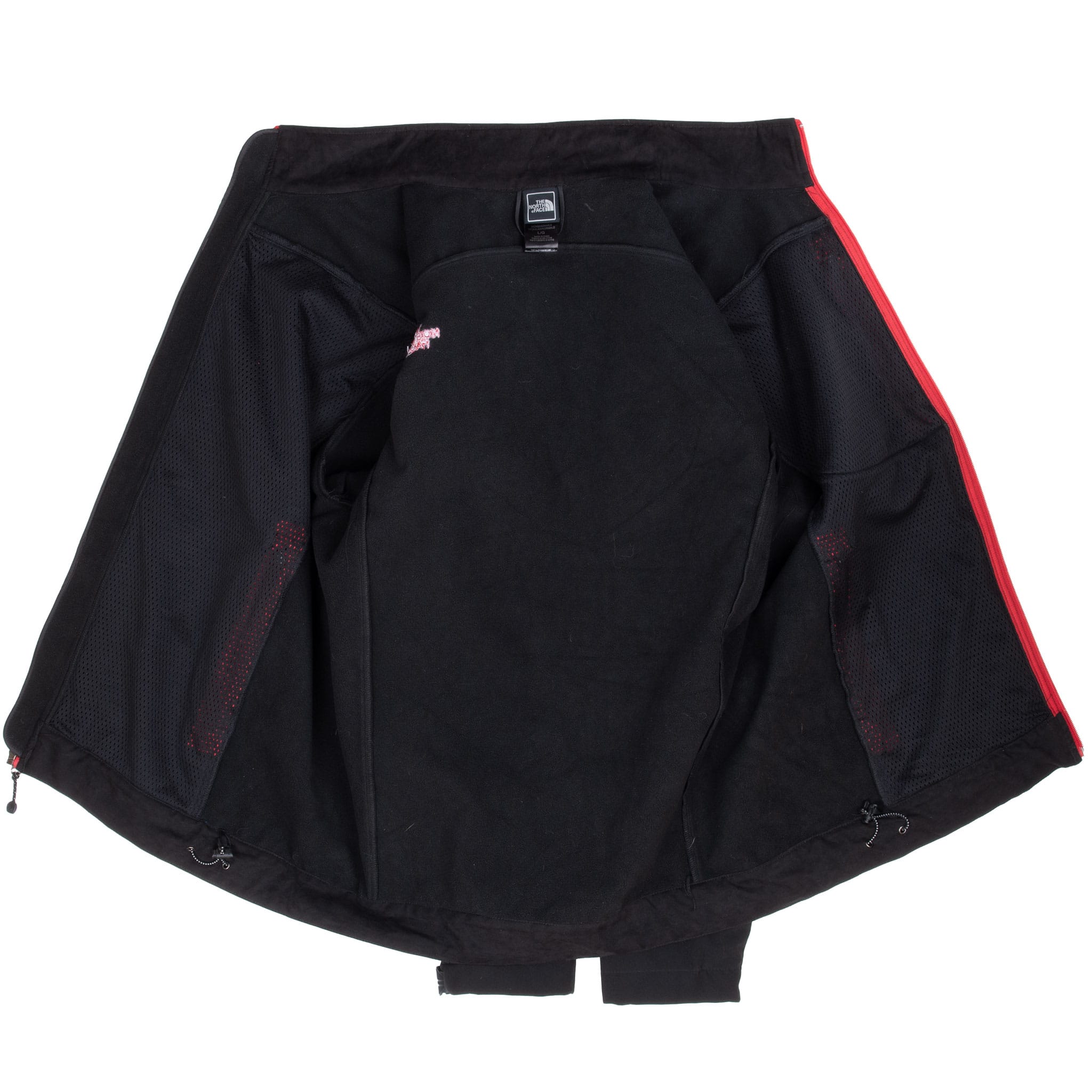Interior of open black The North Face WindWall jacket showing fleece lining and mesh panels