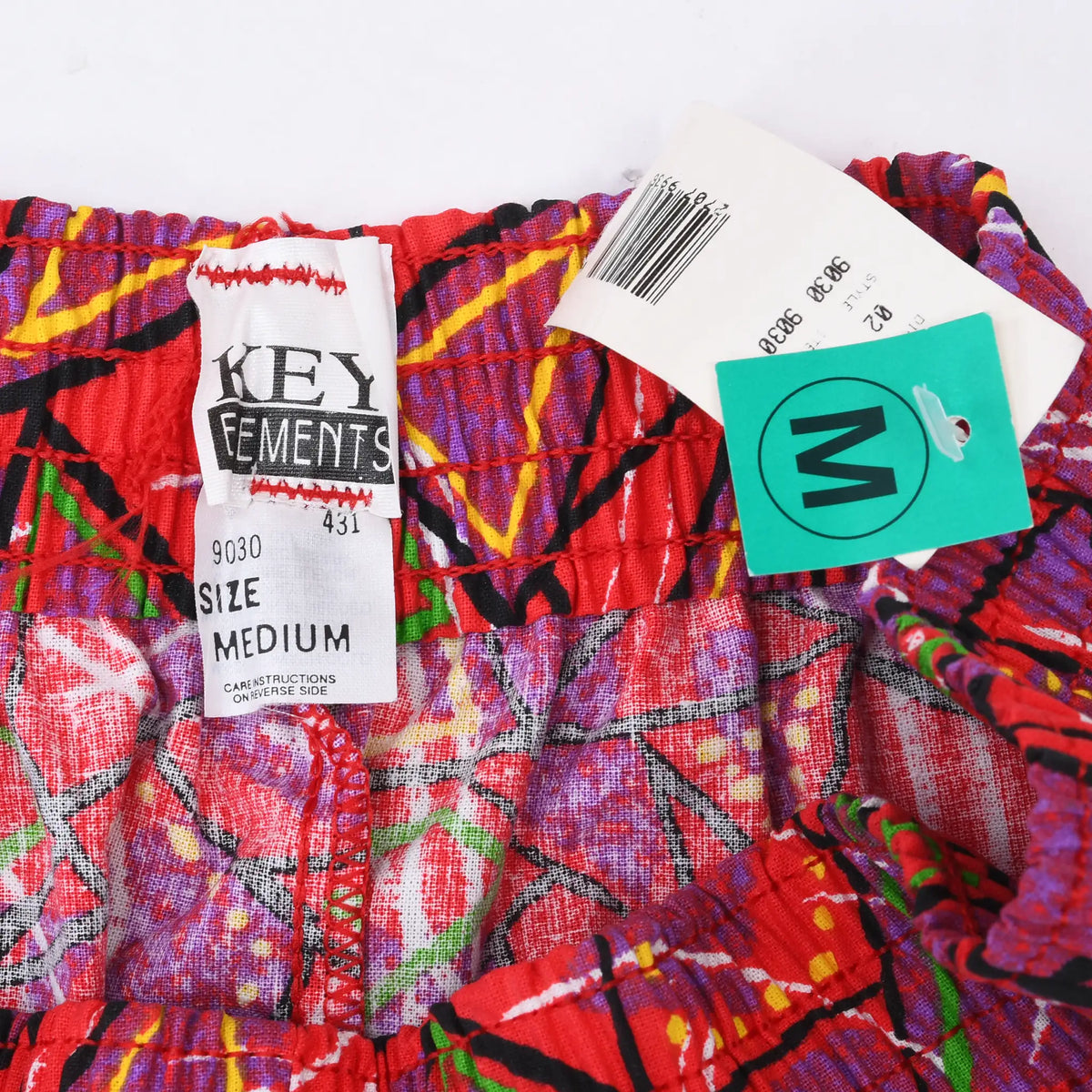 Key Elements size medium waistband label with attached paper tags