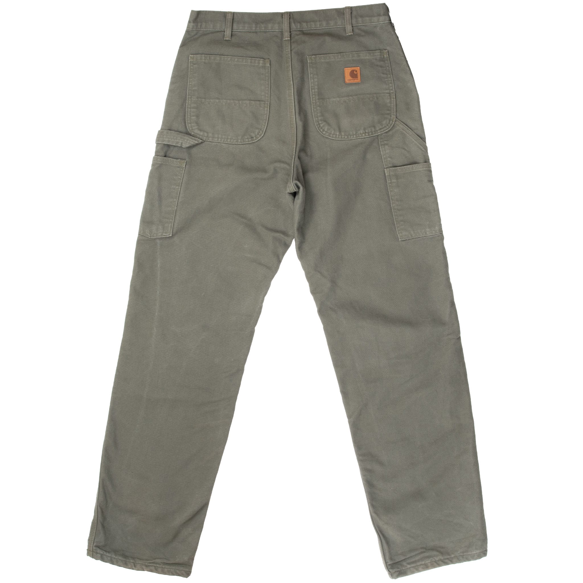Back of green Carhartt carpenter pants with patch and utility pockets
