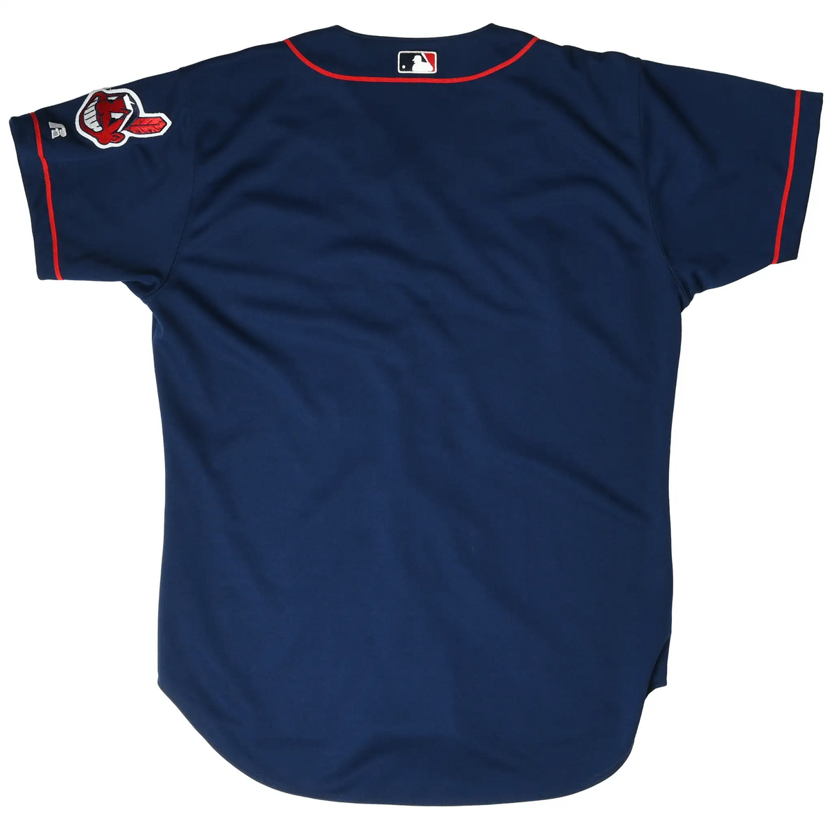 Back of navy Cleveland Indians jersey with sleeve logo patch, red trim, and MLB neck mark