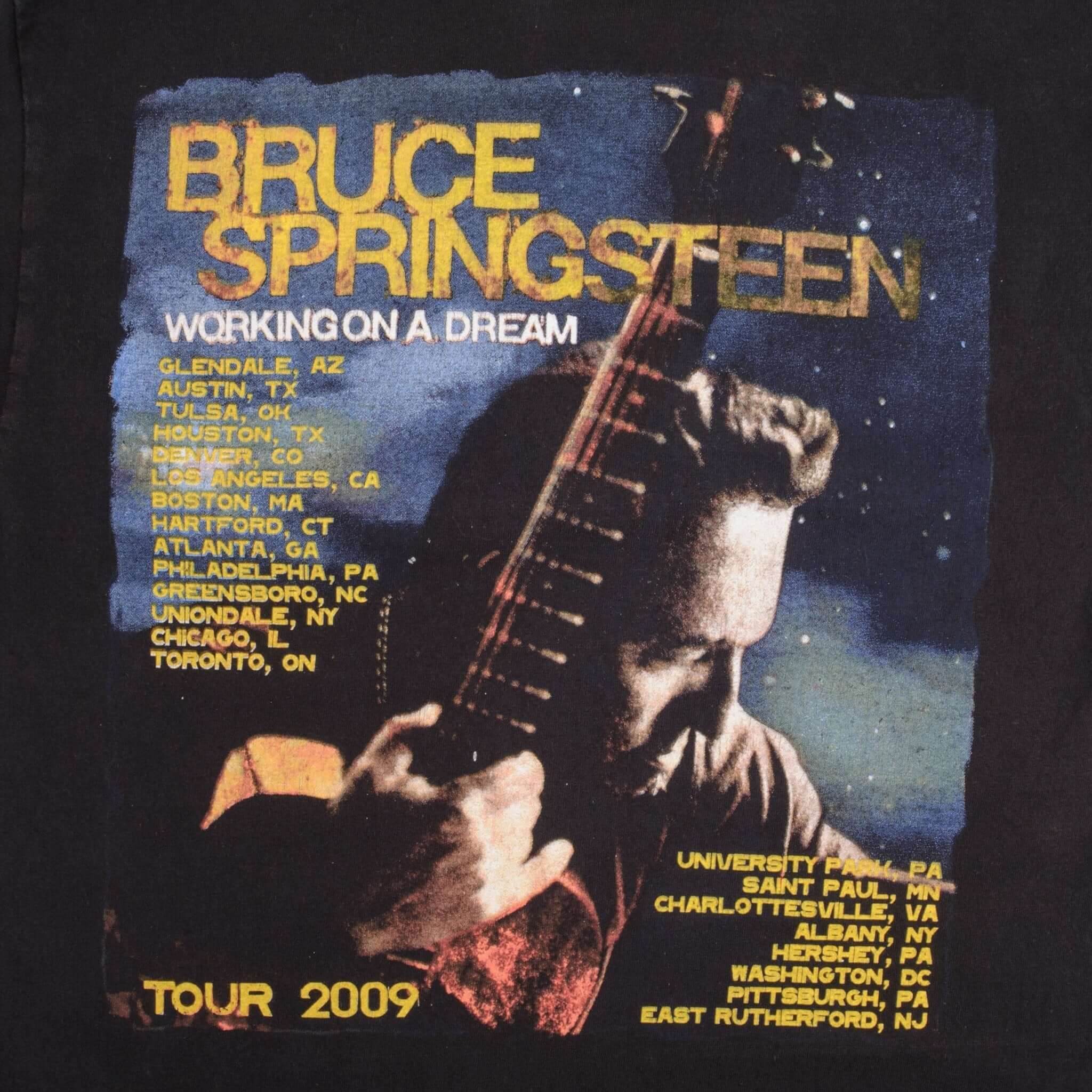 Close-up of Bruce Springsteen 2009 tour back print with guitar portrait and city list