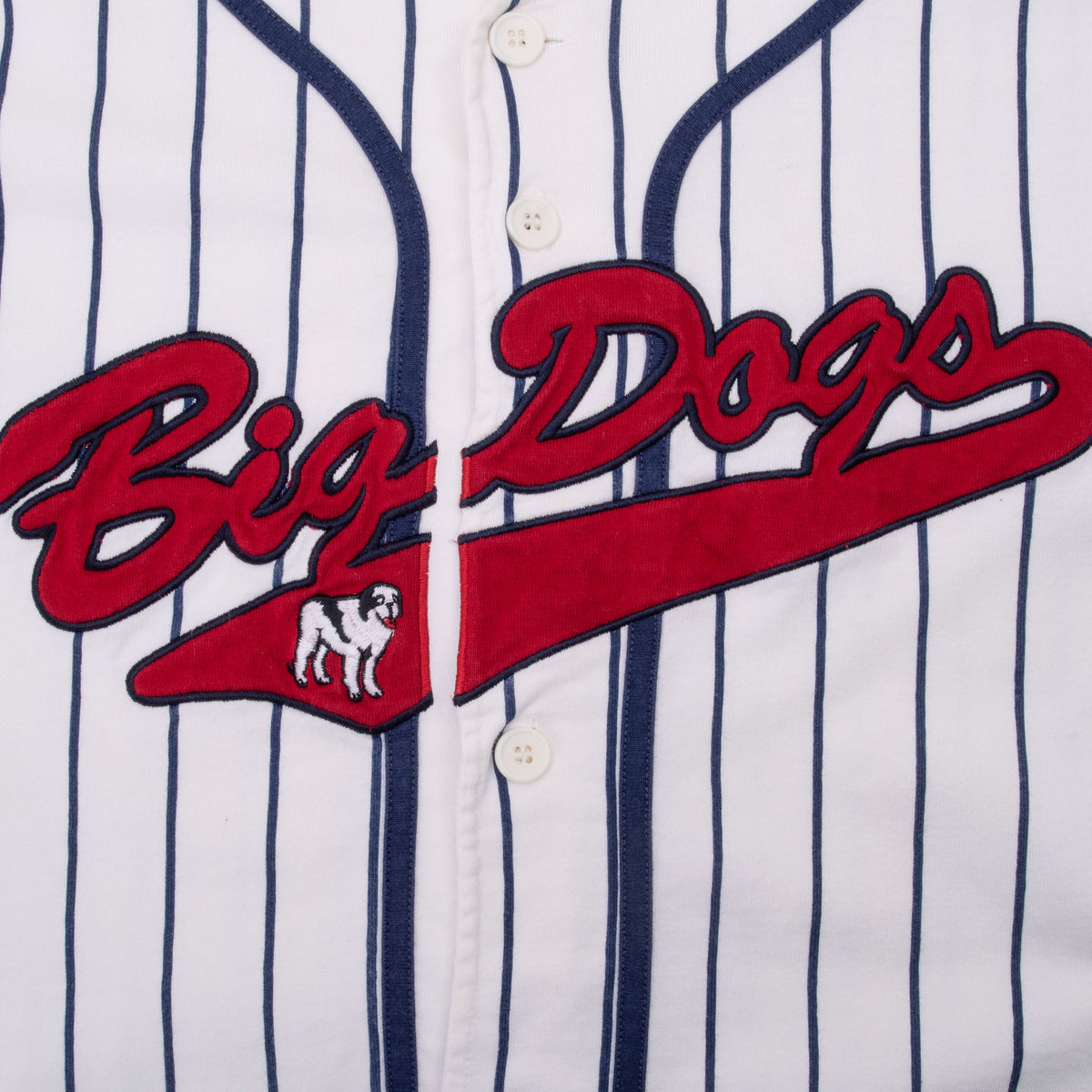 Close-up of red Big Dogs chest embroidery on white pinstriped jersey