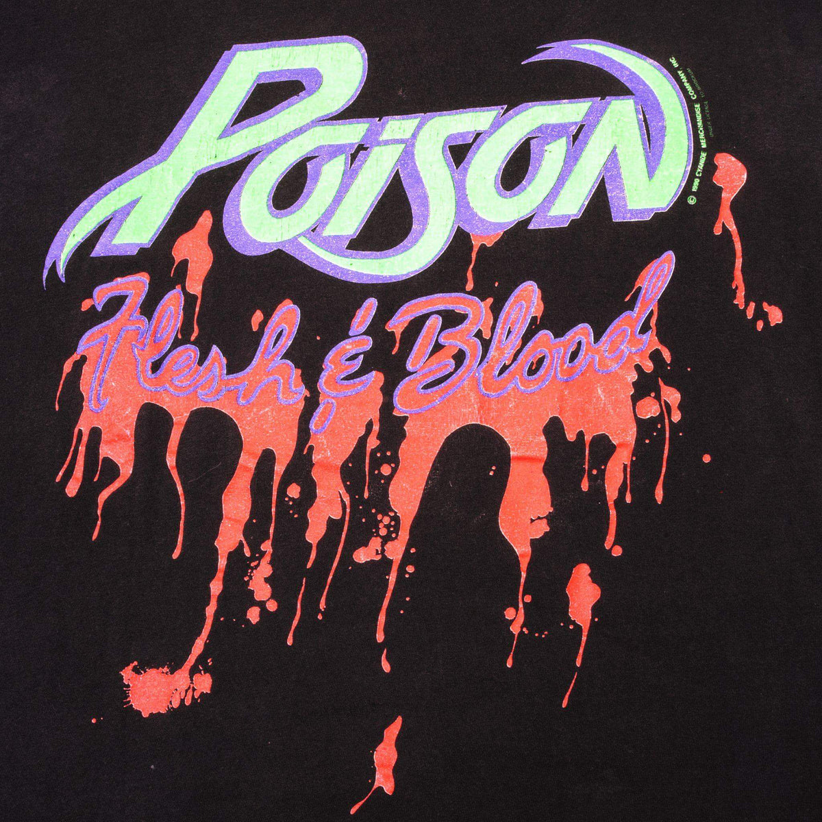 Close-up of green and purple Poison logo with red Flesh & Blood drip print