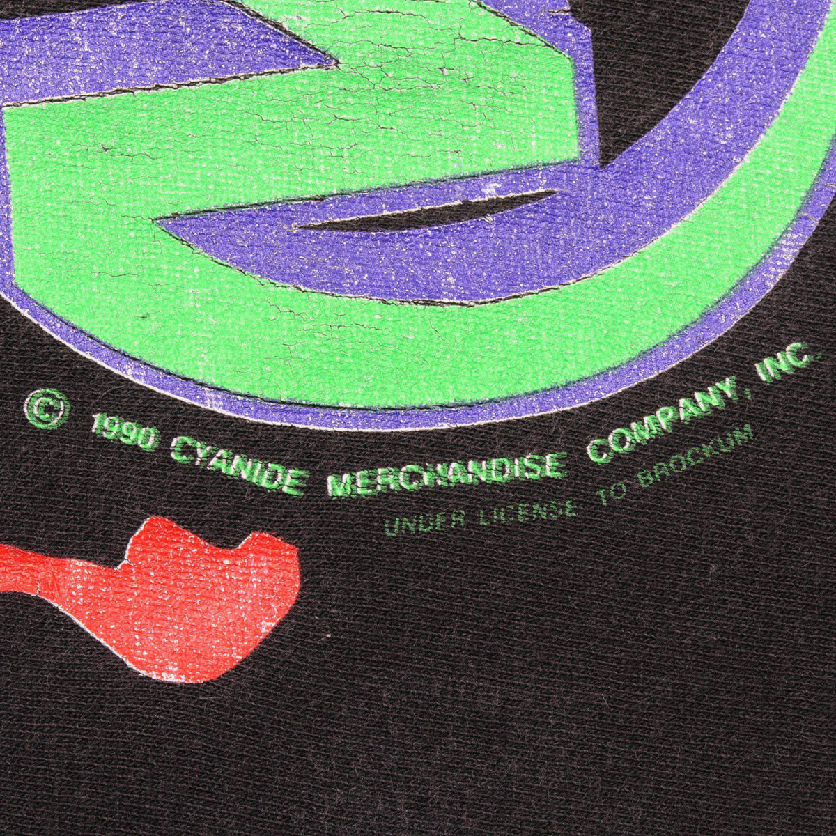 Close-up of 1990 Cyanide Merchandise Company licensing print on front graphic