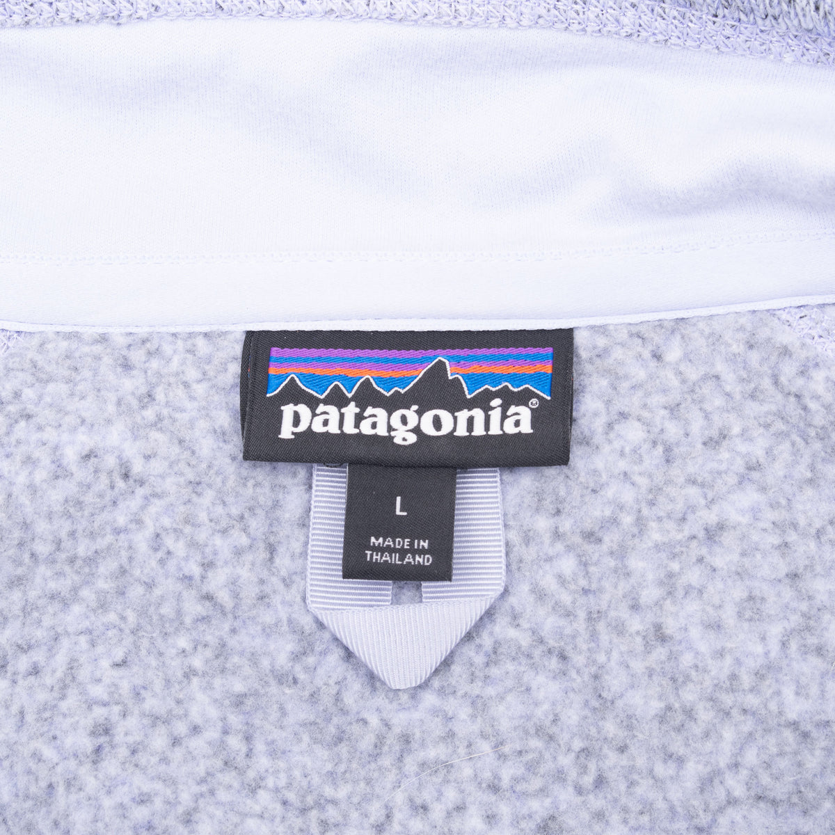 Patagonia neck and size L tags inside light purple Better Sweater fleece
