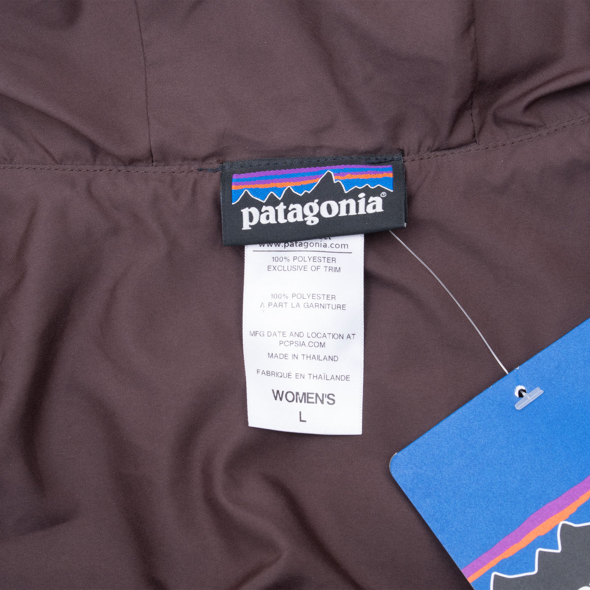 Patagonia neck label and women's large size tag inside brown vest lining
