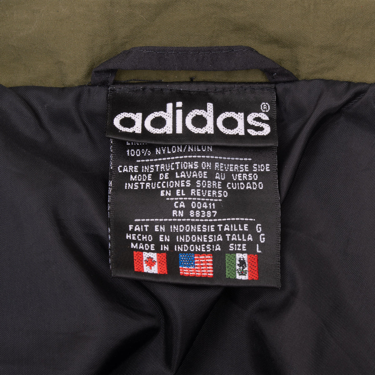Close-up of adidas interior label showing size large and care information