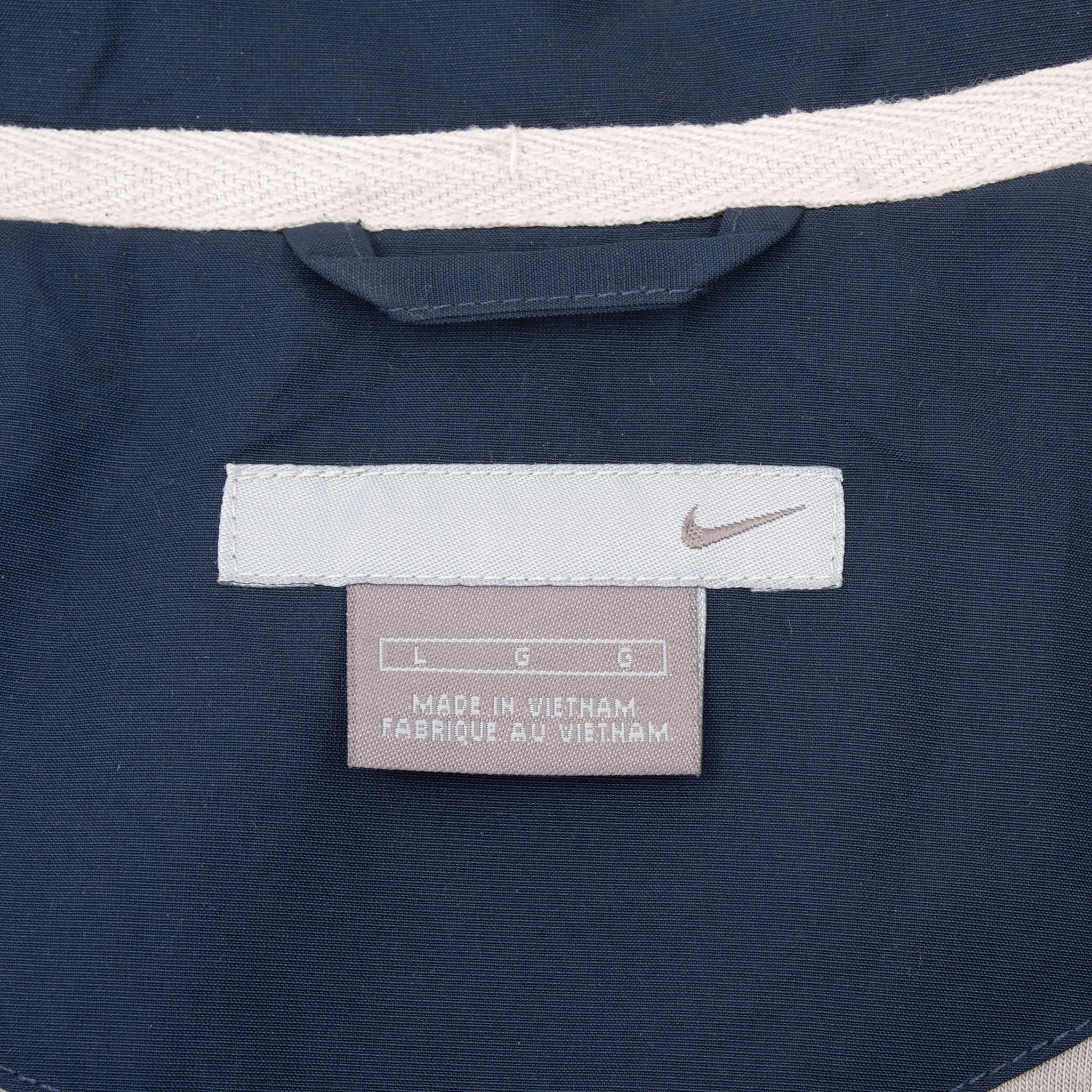 Nike neck and size large labels inside navy windbreaker collar